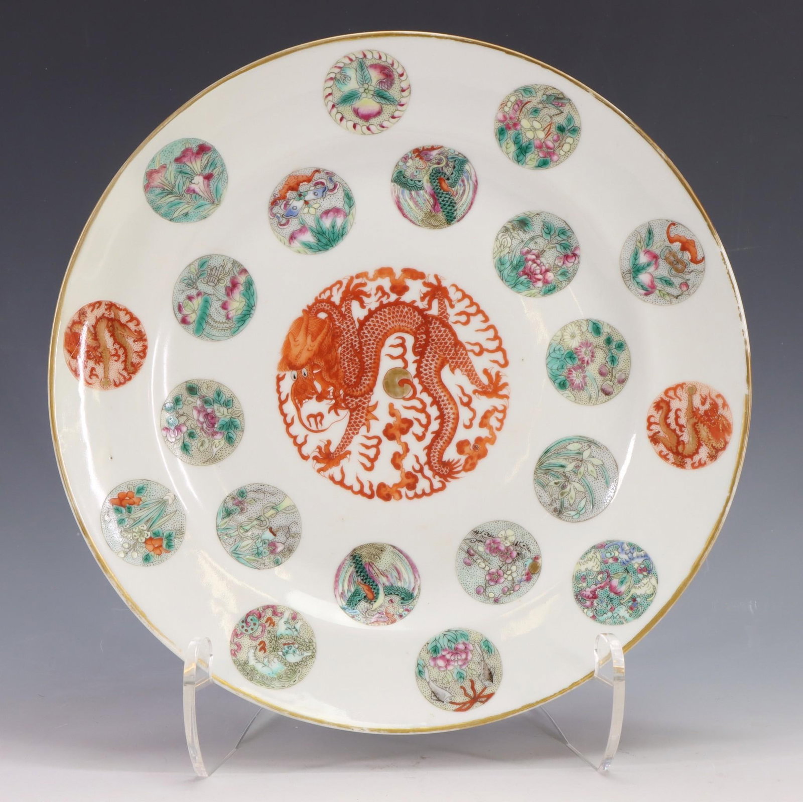 Chinese Famille Rose and Iron Red Porcelain Plate: Qing era, decorated with balls of flowers and dragons with pearls, with Guangxu reign mark. 9.5"w