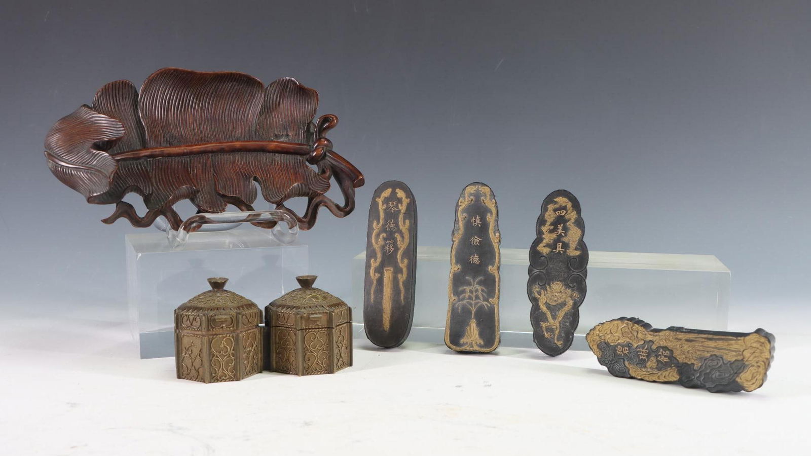 Japanese Calligraphy Accessories: Japanese calligraphy accessories including inkstones, a double inkwell, and pen rest. 7.75"w x 4.5"d