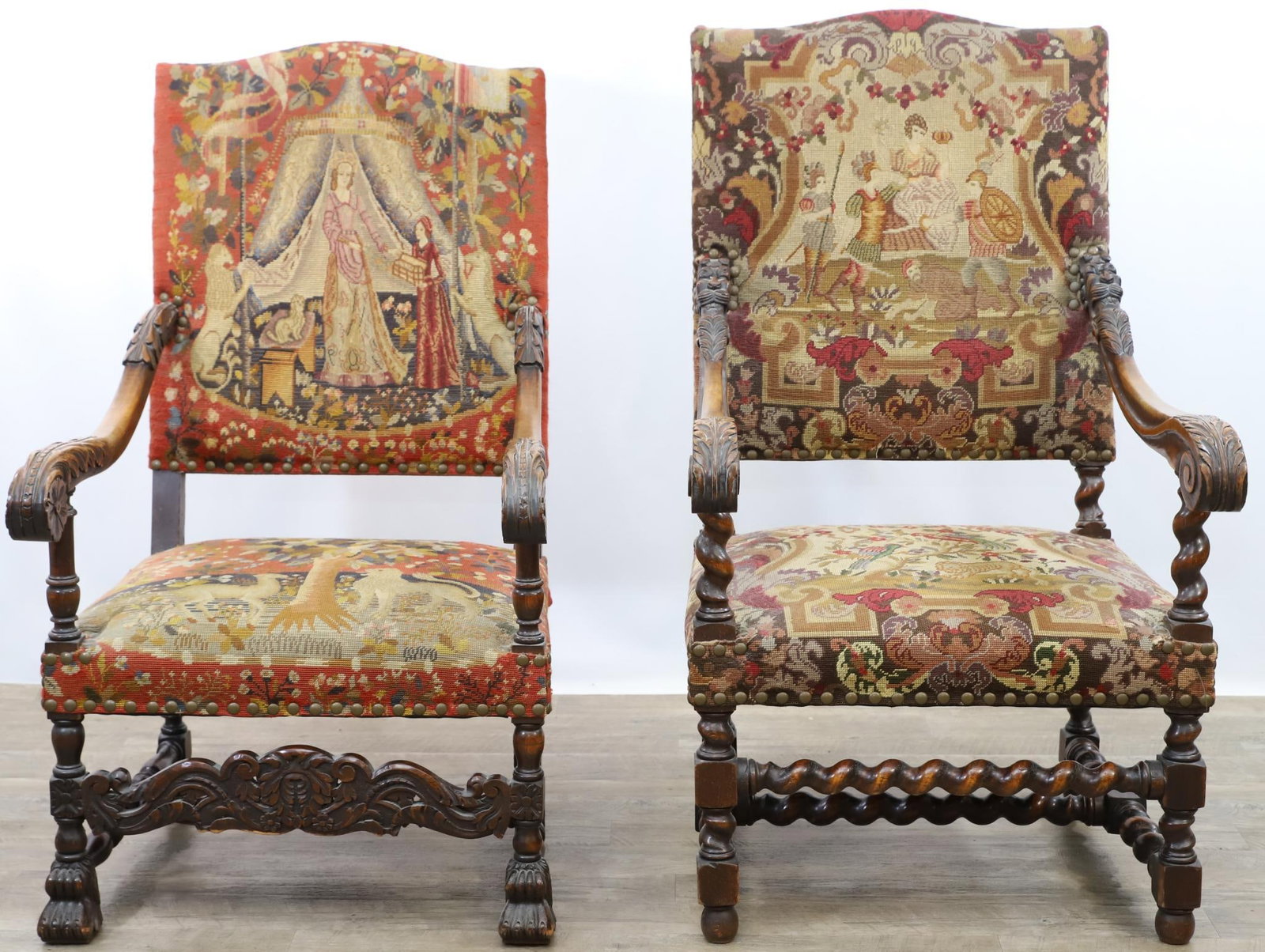 English William and Mary Style Armchairs: Fraternal pair with one having a shaped crest, scrolled acanthus arms, block and turned legs with paw feet and turned stretcher with a scroll carved frieze 46.25"h x 26"w x 28"d, 17.5" seat height. Th
