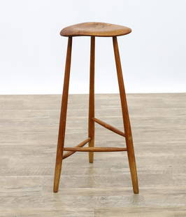 School of Wharton Esherick Three-Legged Stool: Crotch oak bar and hickory stool with a sculpted plank seat, mortise and tenon joinery, and flared tapered round legs with offset cigar stretchers, impressed "M&H 1971", attributed to Esherick's emplo