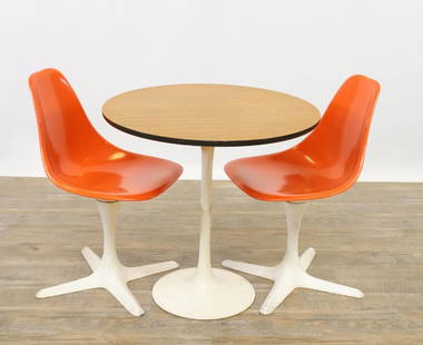 Maurice Burke Tulip Chairs and Table: Model 115 pair of swivel side chairs with burnt orange molded fiberglass seats and white enameled aluminum "propeller" bases, marked. Complementing table with a woodgrain laminate round top and white