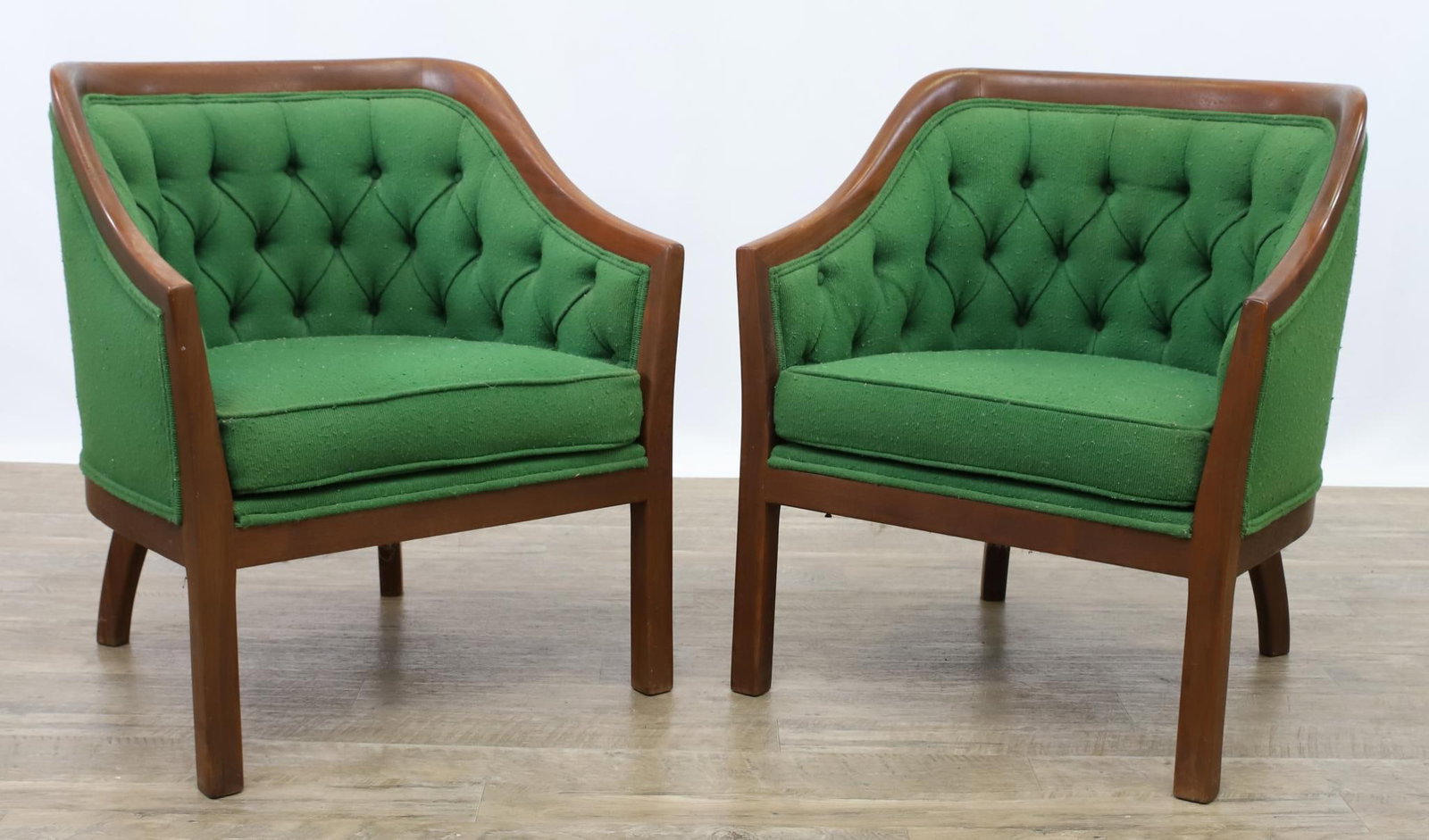 Club Chairs: Walnut frame, curvilinear form, continuous arms, green tufted textured back and frame, on straight front legs and curved back legs. 29"h x 23.5w x 22"d, seat height 16"h