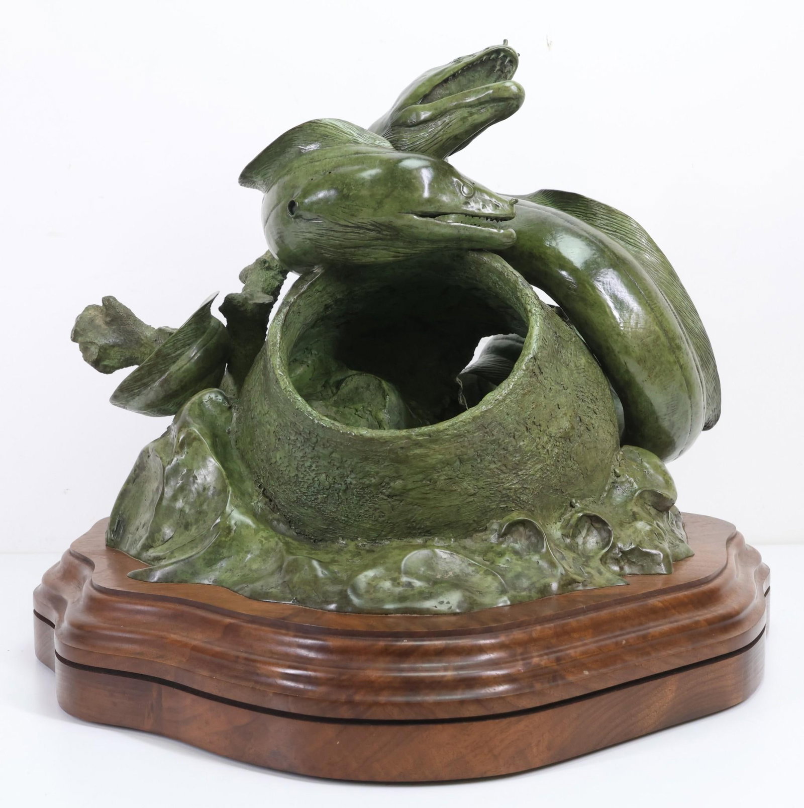 Tony Hochstetler (B. 1964): Bronze sculpture, "Moray Eel", impressed signature to the base, dated 1988, and numbered 4/7, mounted to a revolving wooden stand. 16"h x 18"w overall