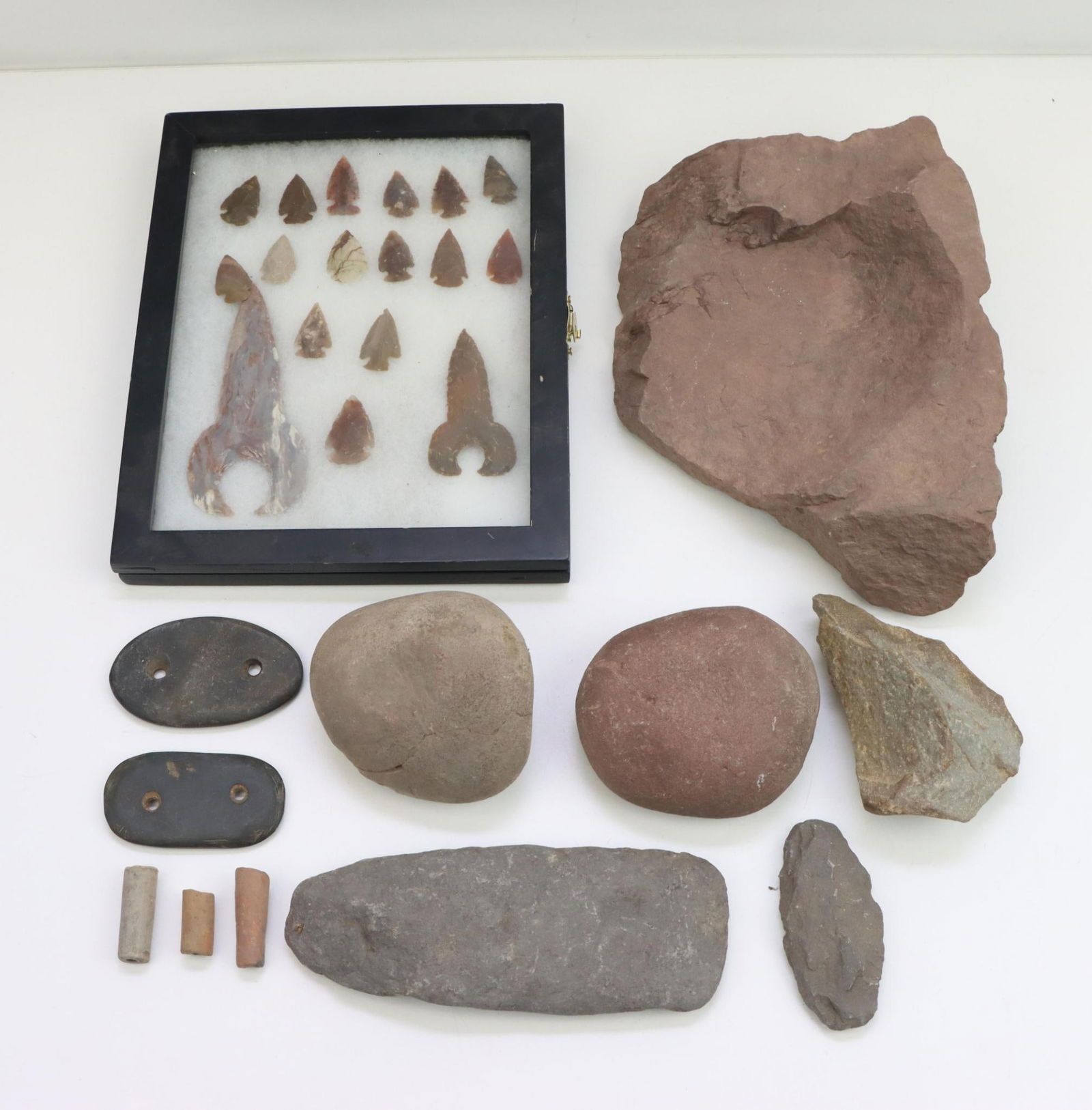 Native American Stone Tools: Native American stone tools, including hammer stones, scrapers, mortar (10") and pestle, gorgets, pipe shards, and quarter moon and crescent moon jasper arrowheads.