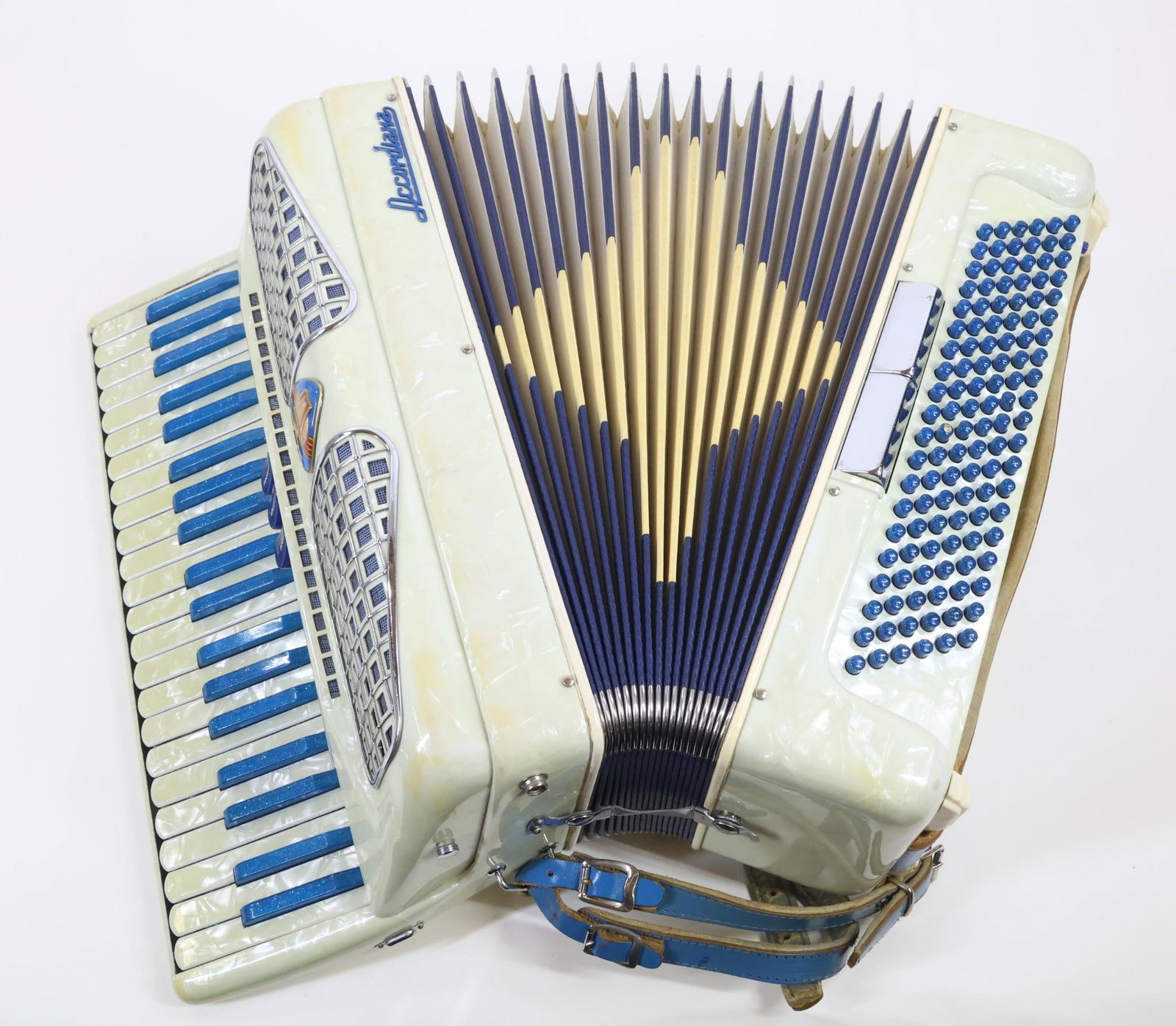 Excelsior Accordion: Accordion "Accordiana" Made by Excelsior, Italy. 120 Bass. "Ladies' Size". White Pearl Cabinet Work. Blue Sparkle "Black" Keys. Fully Play Tested. No Leaks. Hard Case Needs Handle Repair. Proceeds ben