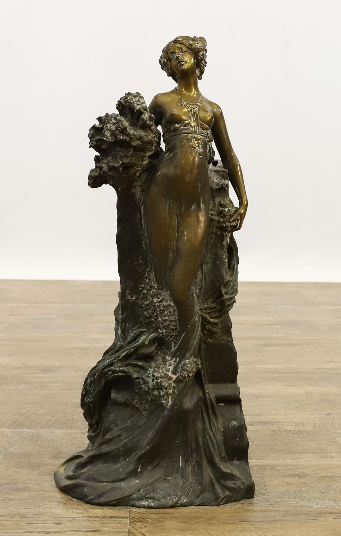 Francois Alphonse Piquemal (1869 - 1911): Art Nouveau French bronze sculpture of a partially nude woman emerging from foliage, modeled as an umbrella stand. Impressed signature to the base. 28"h x 13"w x 11"d