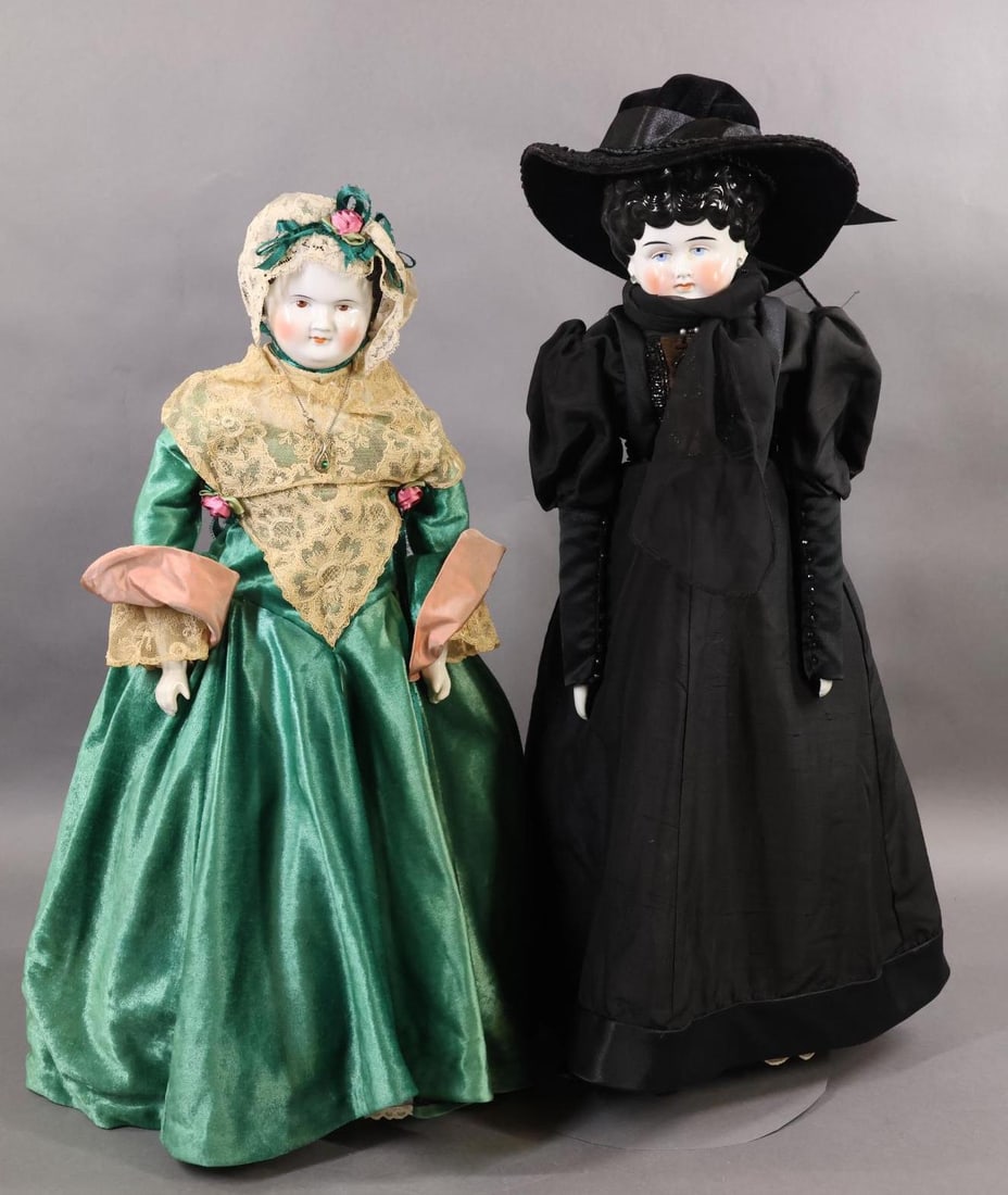 CHINA DOLLS.: Pair of antique China shoulder head dolls. Both dolls have black center part hair. They were redressed by a professional seamstress (Emma G.). Doll 1) 24" Low Brow doll marked PATENT PP'D GERMANY. She
