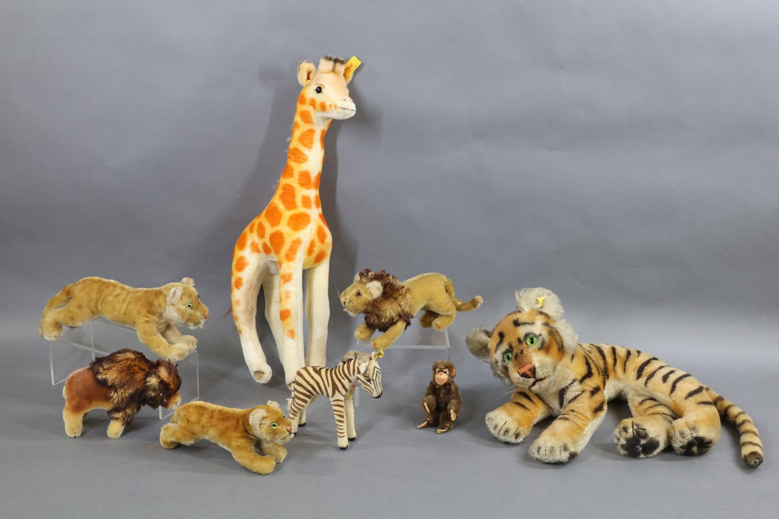 VINTAGE STEIFF.: LOT of (8) Wild Animals. Velveteen - 5" "Zebra", Ivory with black stripes. Paper chest tag, raised silver button, yellow tag 6412/00. Condition: stripes and mane have age fading. Mohair - 19" "Giraffe