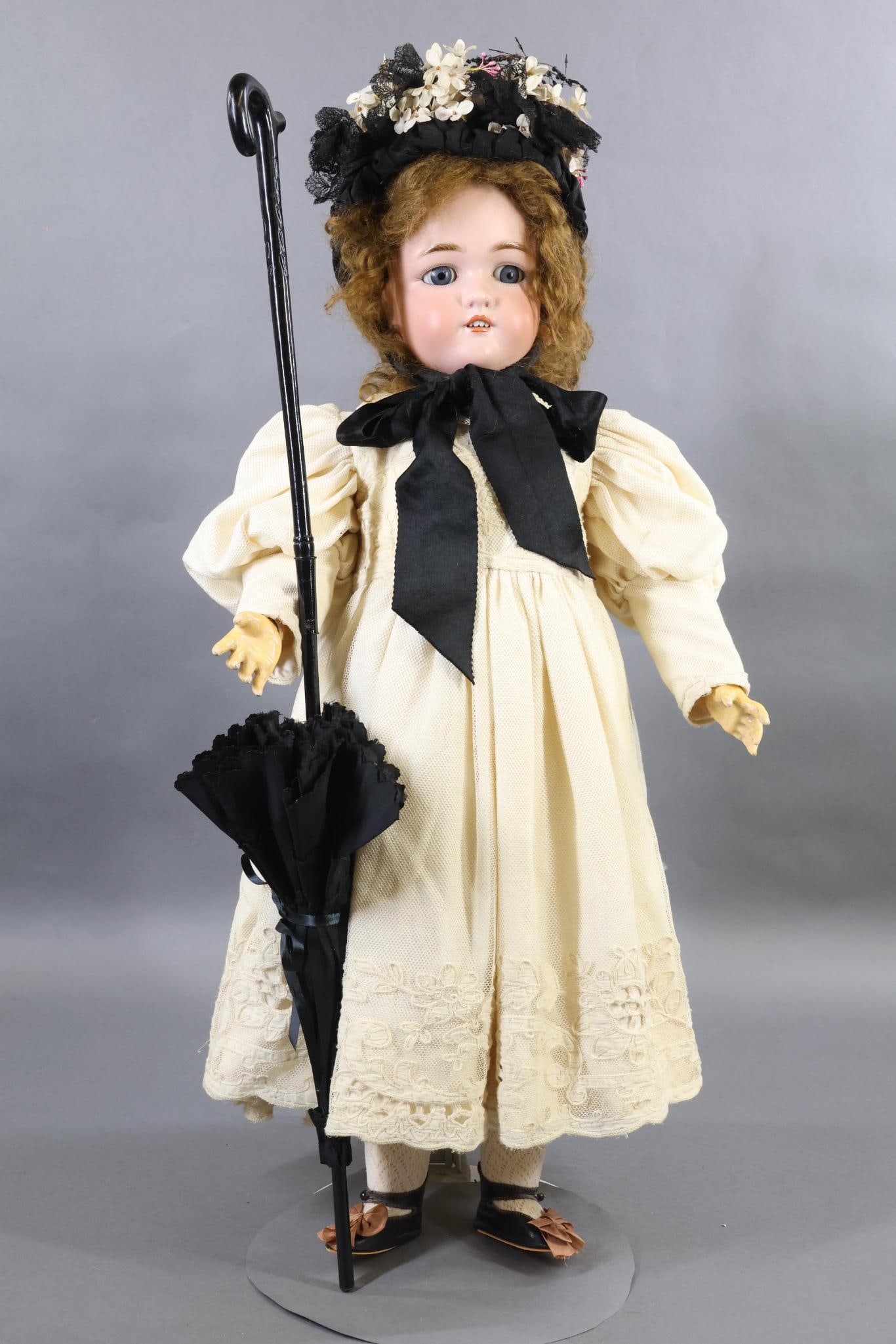 GERMAN BISQUE DOLLS.: 29" 1349 JUTTA S & H 12 doll with blue sleep eyes, open mouth, pierced ears, long curly brown mohair wig. Papier mache ball jointed body. Dressed in custom made ivory embroidered tulle over ivory silk