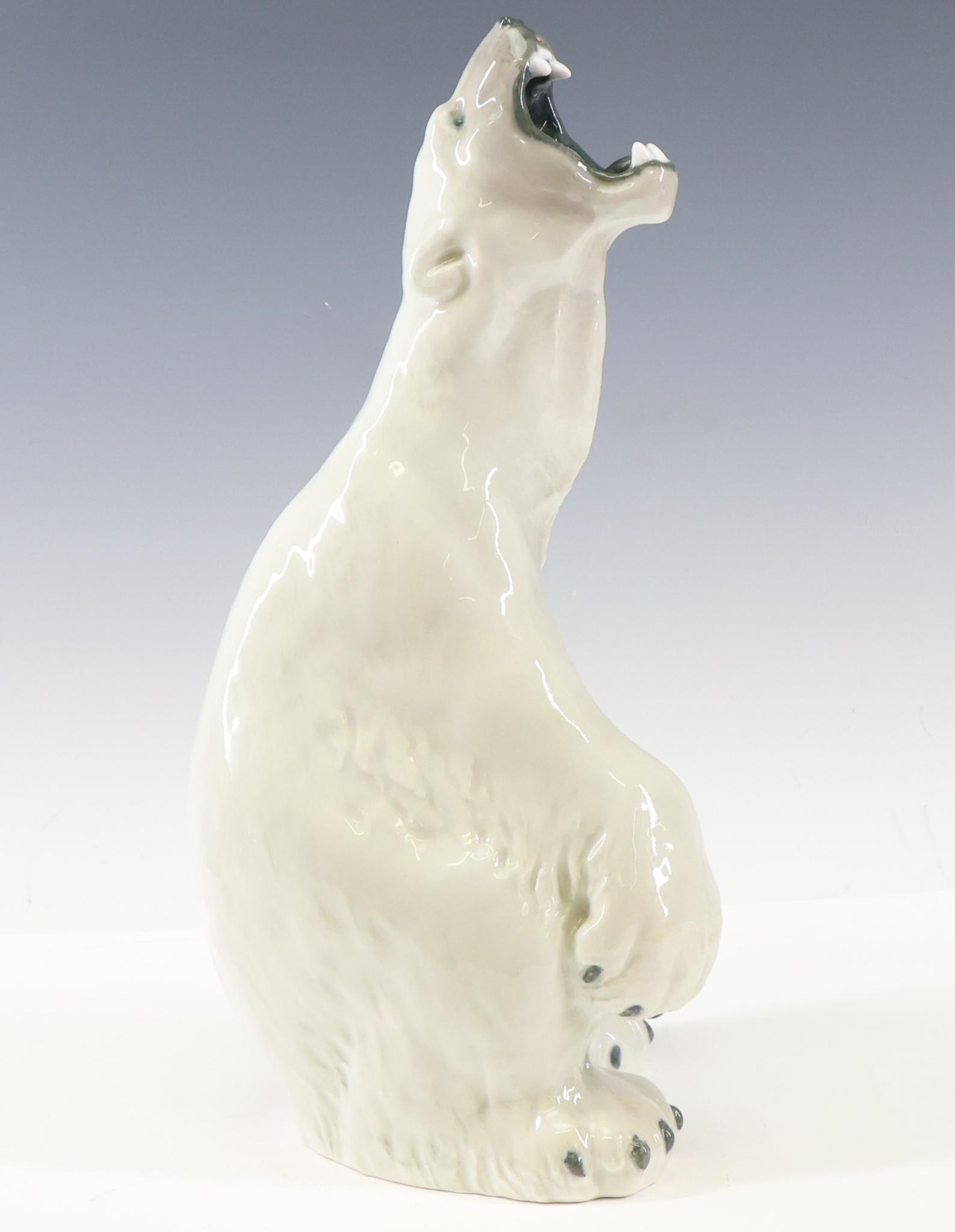 C. F. Liisberg for Royal Copenhagen Polar Bear: Danish porcelain roaring polar bear figure designed by Carl Frederik Liisbjerg (1860 - 1909), with 1894 - 1900 Royal Copenhagen marks, numbered L9/5540, and with artist's signature underglaze. 12.25"h