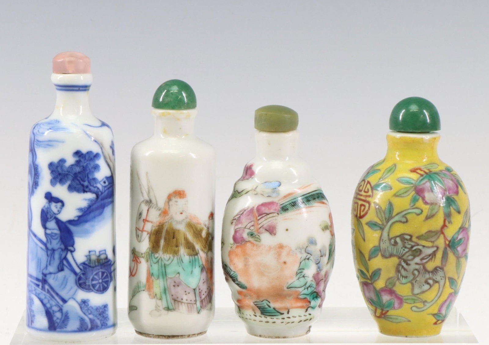 Chinese Snuff Bottles: Qing era snuff bottles, comprising of a blue, white and gray decorated cylinder shaped bottle with a depiction of 3 Arhats/Luohan including Handaku Sonja and his dragon, signed with spurios kangxi mar