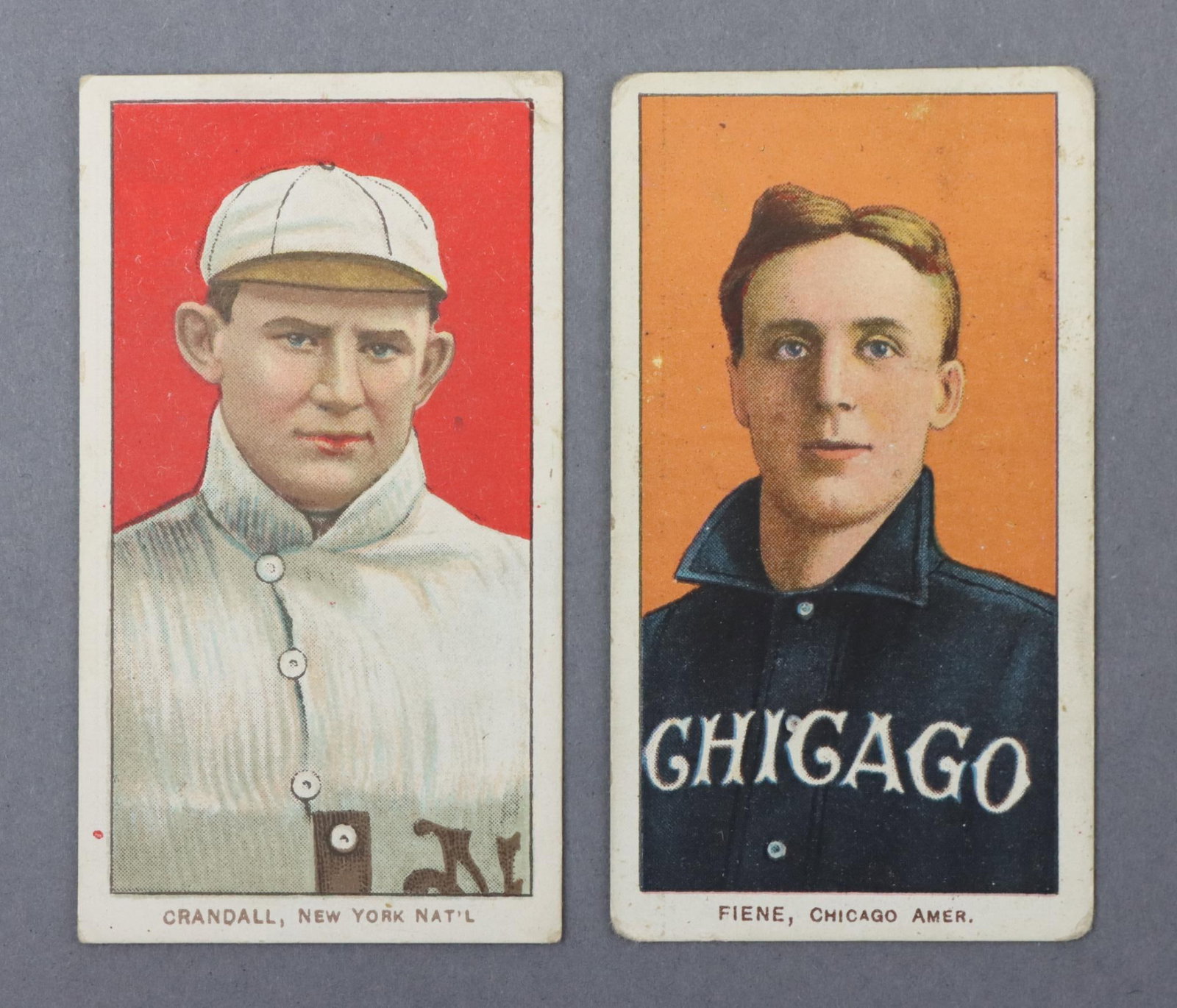 (2) 1909-11 T206 Polar Bear Baseball Tobacco Cards: (2) 1909-11 T206 Polar Bear Factory No. 6 White Border baseball tobacco cards: Doc Crandall (portrait w/hat variation) & Lou Fiene (portrait variation). Crandall has excellent centering w/a small 1/4"