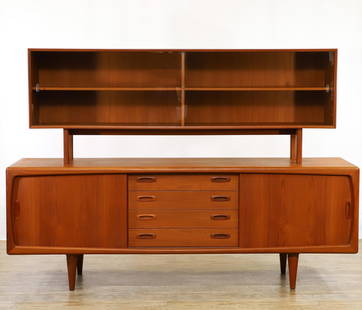 Hans Peter Hansen Sideboard and Hutch: Danish Modern teak two-part wall unit, the lower part a sideboard with four central drawers flanked by cabinets with sliding doors which open to adjustable shelving, on tapered round legs, and the upp