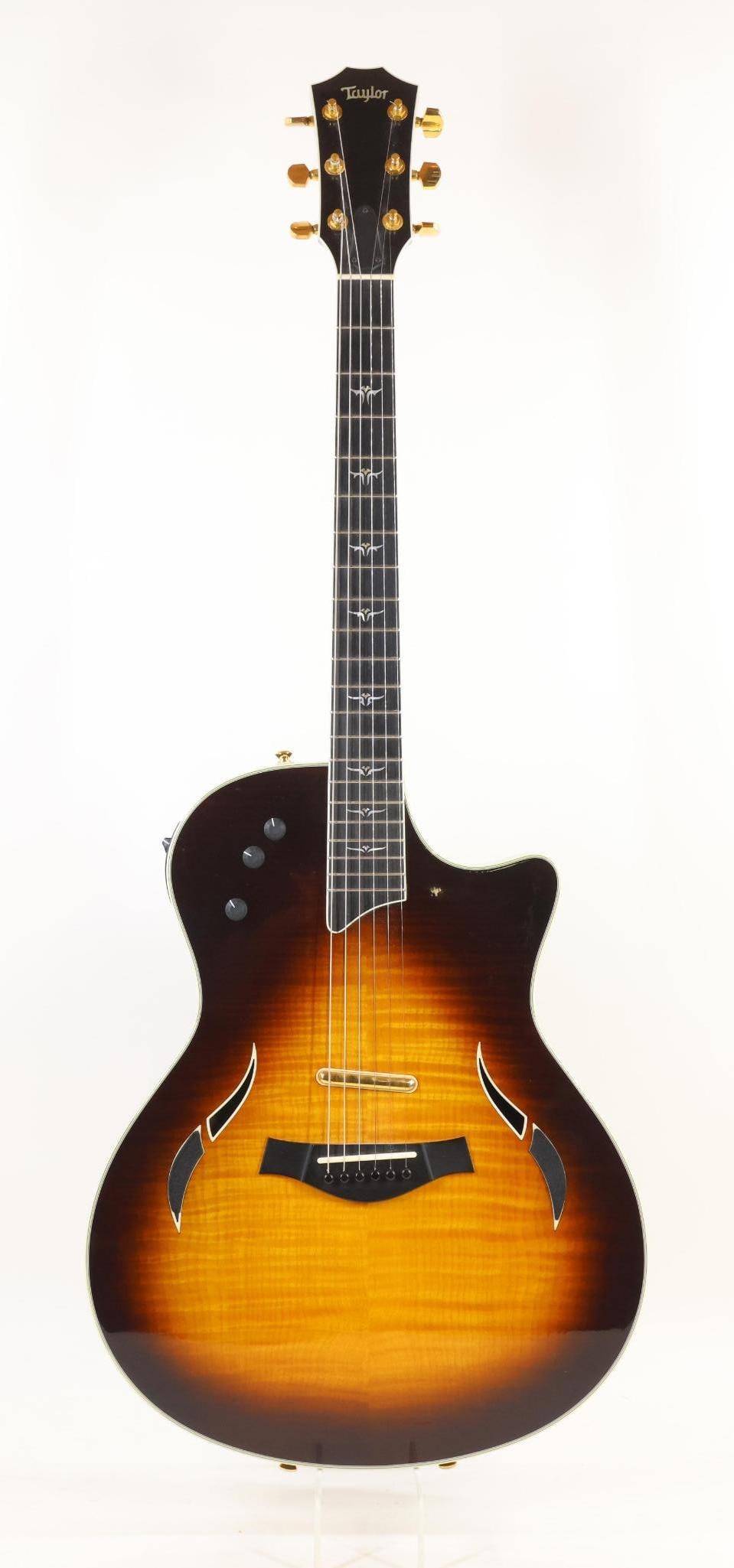 Taylor T-5 Acoustic Electric Guitar: Taylor T-5 Thinline Acoustic Electric Guitar. Serial Number 20051006533, Made in USA, 2005. Flamed Maple Top, Mahogany Back and Sides, Ebony Fingerboard. Excellent Used Condition with Minor Finish Wea