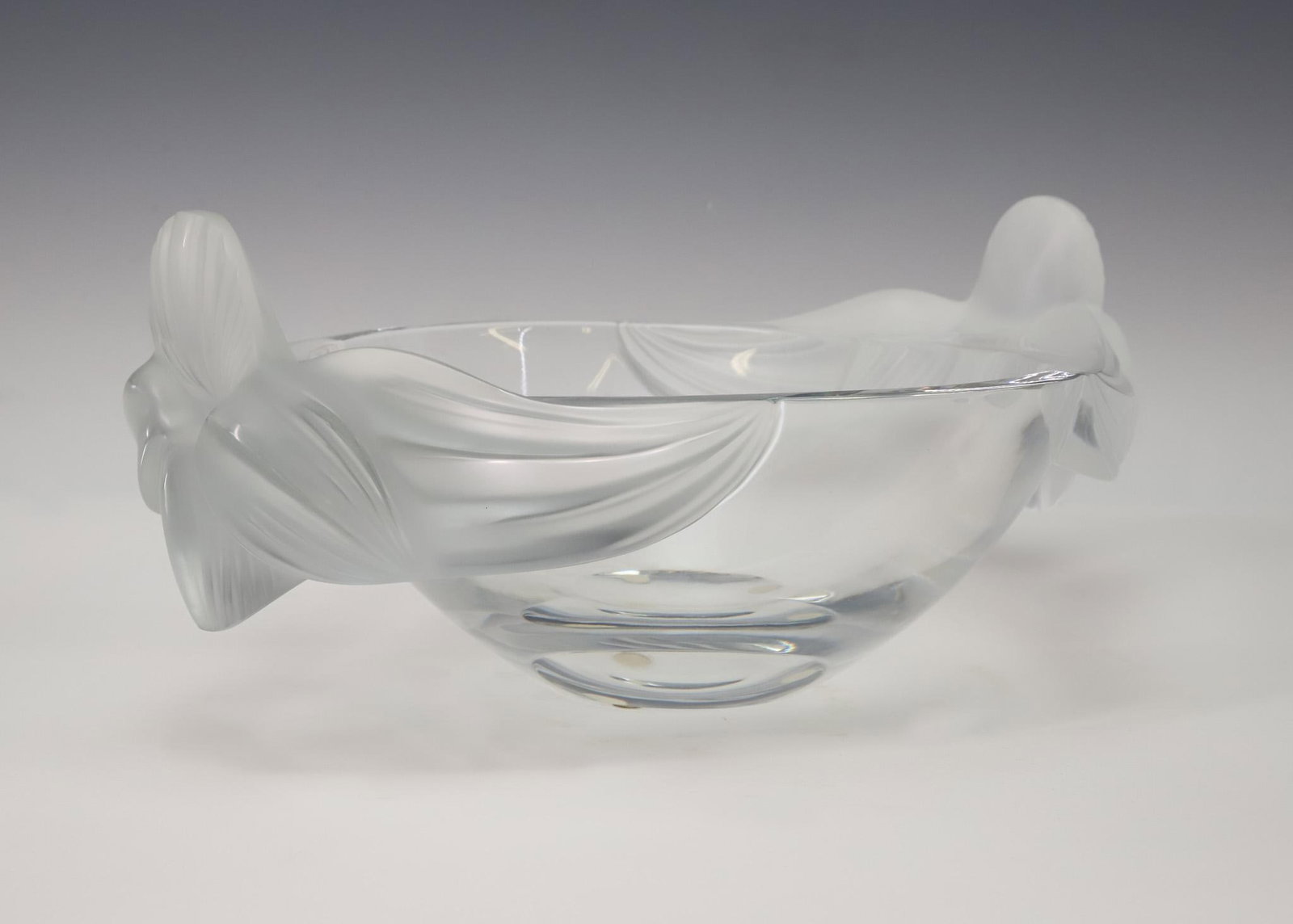 Lalique "Loriol" Crystal Bowl: French crystal bowl with frosted orchids, late 20th C. marks. 5.25"h x 11.5"w x 8.5"d