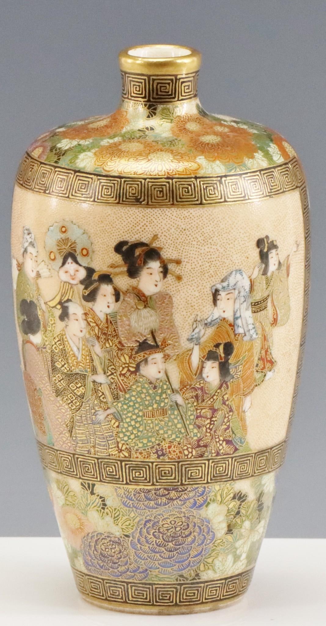 Nikkozan Japanese Satsuma Pottery Vase: Meiji era Satsuma pottery vase, decorated with a panel depicting a boy and girl with attendants, surrounded by chrysanthemums and other flowers, and with meander borders. Marked Nikkozan to the foot. 