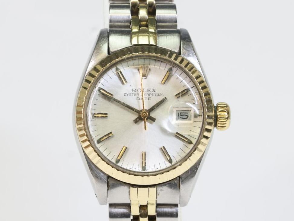 Ladies Rolex 6917 Oyster Date: Ladies Rolex #6917/3, serial #6259499, featuring a silver stick dial, stainless steel case, 14K yellow gold fluted bezel, and two-tone Jubilee 62523D-14 bracelet.