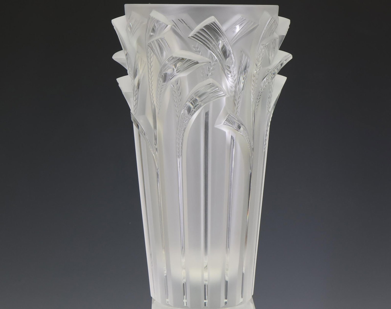 Lalique Crystal Vase: French molded crystal vase, clear and frosted with stalks of wheat in relief, with engraved markings and label. 11.75"h x 7"w