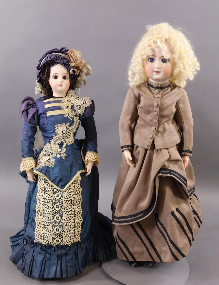 ARTIST DOLLS.: Pair of REPRODUCTION French dolls. Both dolls have bisque socket heads, stationary eyes, closed mouths and are attractively dressed in reproduction French style 2 pc. outfits. Doll 1) 20" "Tete Jumeau