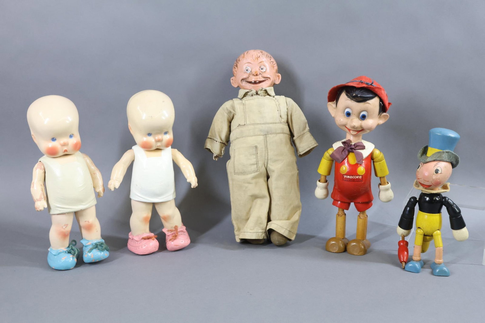 COMPOSITION/WOOD CHARACTER DOLLS.: LOT of (5) dolls. Composition - Pair of 10" unmarked HORSMAN 1925 HEbee and SHEbee dolls. He has the painted blue shoes, she has pink shoes. Condition: HEebee has paint loss. SHEbee may have had under