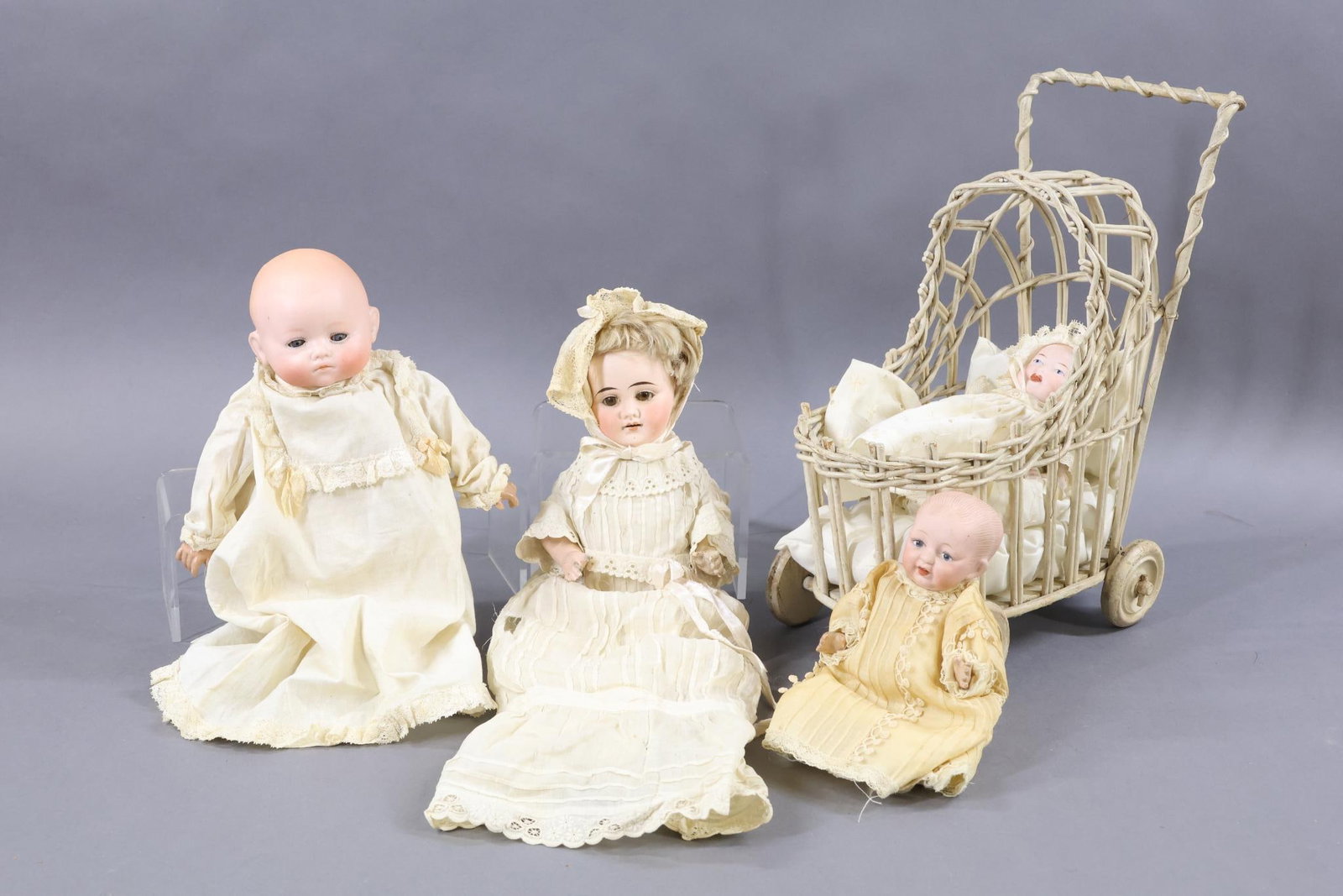 BISQUE DOLLS 12"/UNDER.: LOT of (4) GERMAN Baby dolls. (3) Are solid dome dolls, (1) has a wig. All are dressed in vintage/antique clothing. Pair of dolls with molded, painted features. Both have blue eyes, blonde hair. 6 1/2