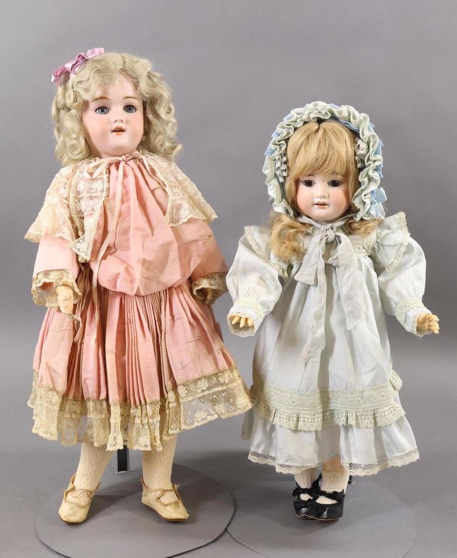 GERMAN BISQUE DOLLS.: Pair of dolls. Both of these dolls have blonde wigs, open mouths, papier mache jointed bodies and are attractively dressed in pastel silk outfits. Doll 1) 20" 119-10 1/4 HANDWERCK GERMANY doll with bl