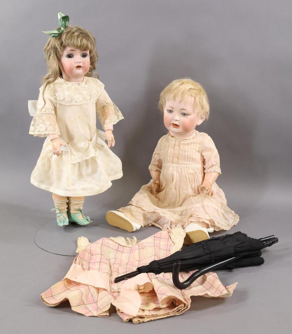 GERMAN BISQUE DOLLS.: LOT. Pair of dolls and accessories. Doll 1) 18" SIMON & HALBIG K * R 46 with stationary blue eyes, open mouth, pierced ears, papier mache ball jointed body. Long tosca mohair wig. Dressed in antique c