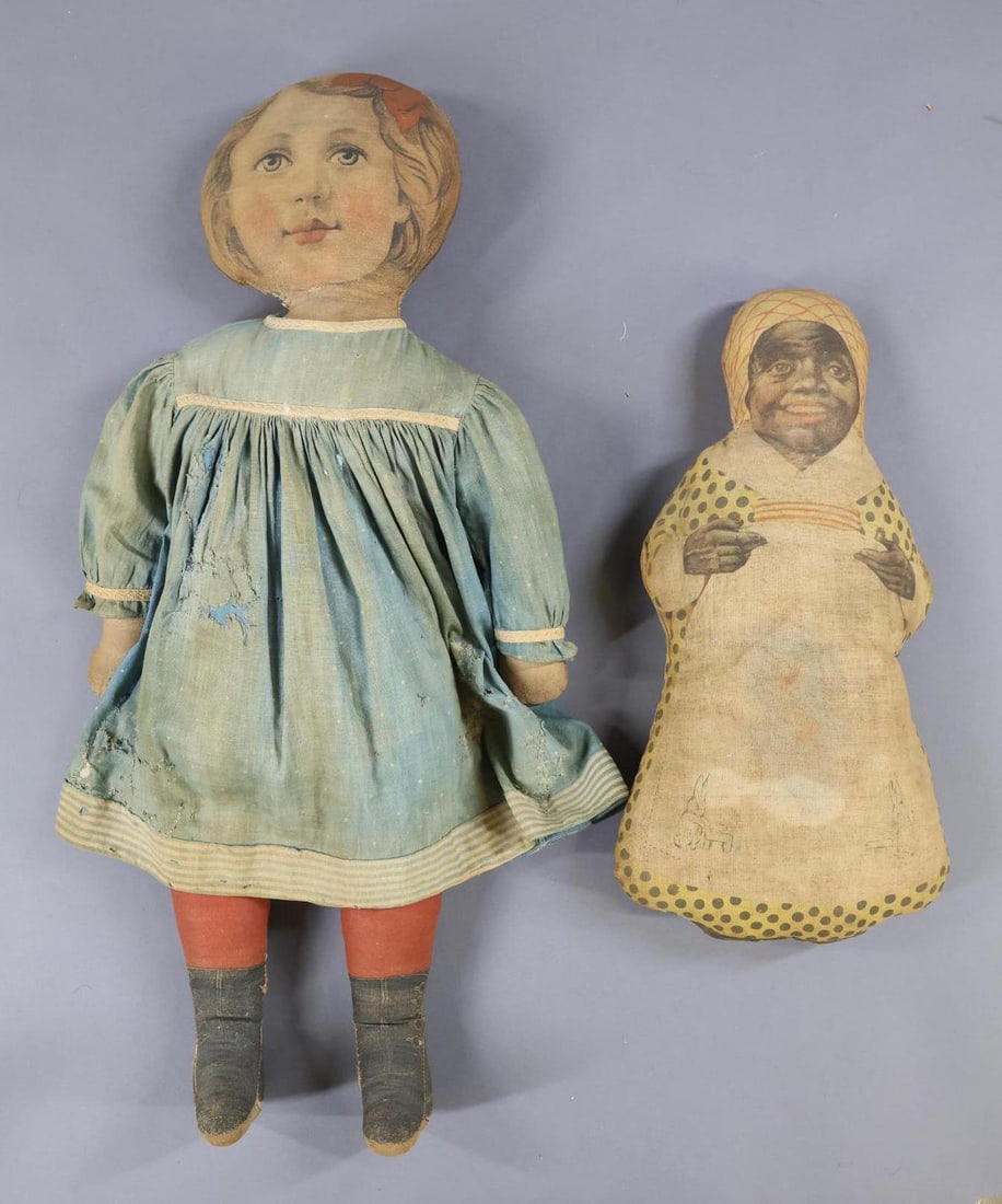 CLOTH DOLLS.: Pair of antique printed cloth dolls. 15" "Aunt Jemima". Condition: age discoloration, fading. 26" Fabric Art Mills female child doll. She has printed underwear and is also wearing an antique dress. Co