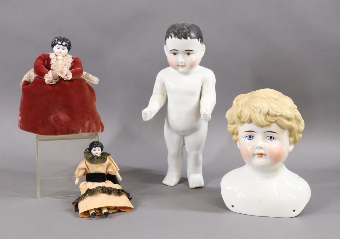 CHINA, PARIAN DOLLS.: LOT of China items. 10 1/2" "Frozen Charlotte" doll with painted brown eyes, black hair. (Chip on toes of right foot.) (2) Low brow dolls with black hair - 6 1/2" shoulderhead mounted on a pin cushion