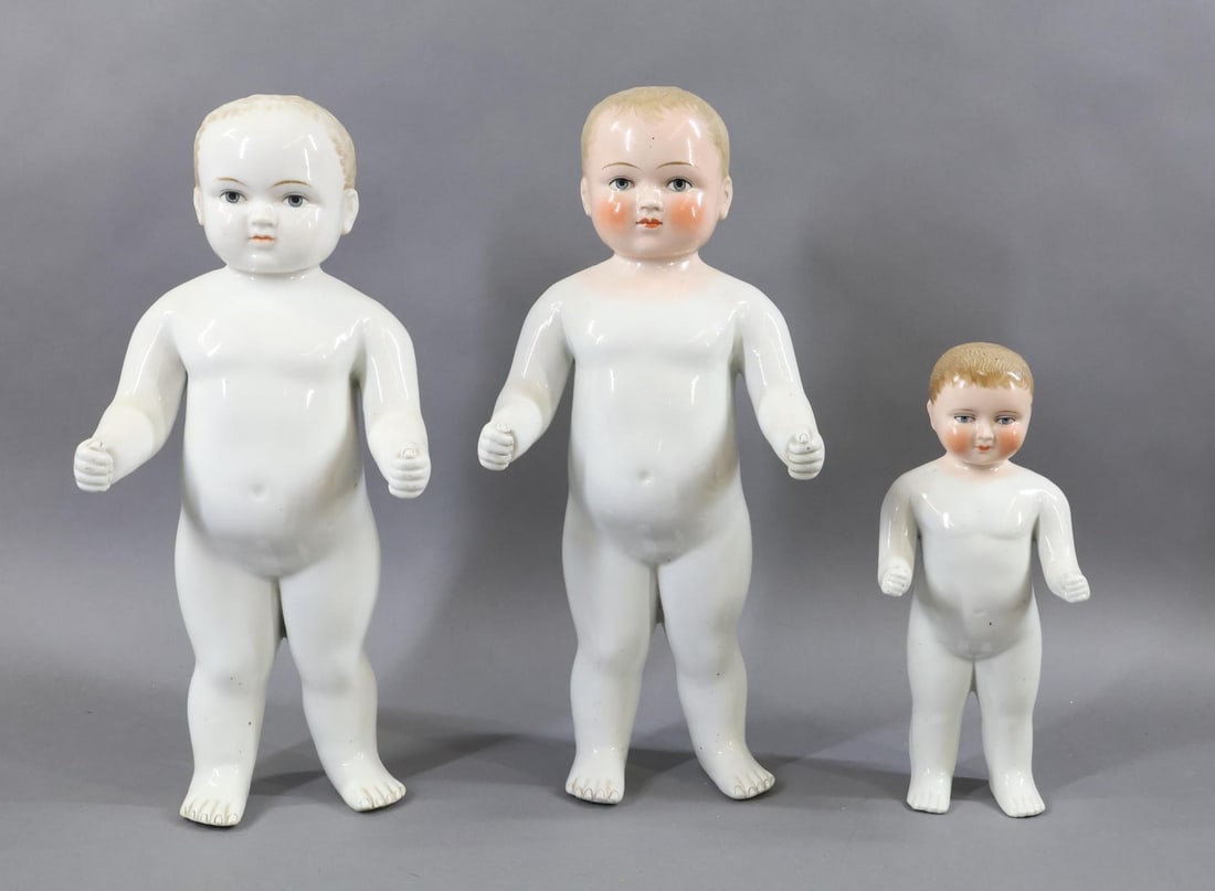 CHINA, PARIAN DOLLS.: LOT of (3) China "Frozen Charlotte" Dolls. 10" , 15", 15". All of them have painted blonde hair, blue eyes. The 10" and (1) 15" have pink tint heads. (3) Doll stands. Condition: nothing observed on ch