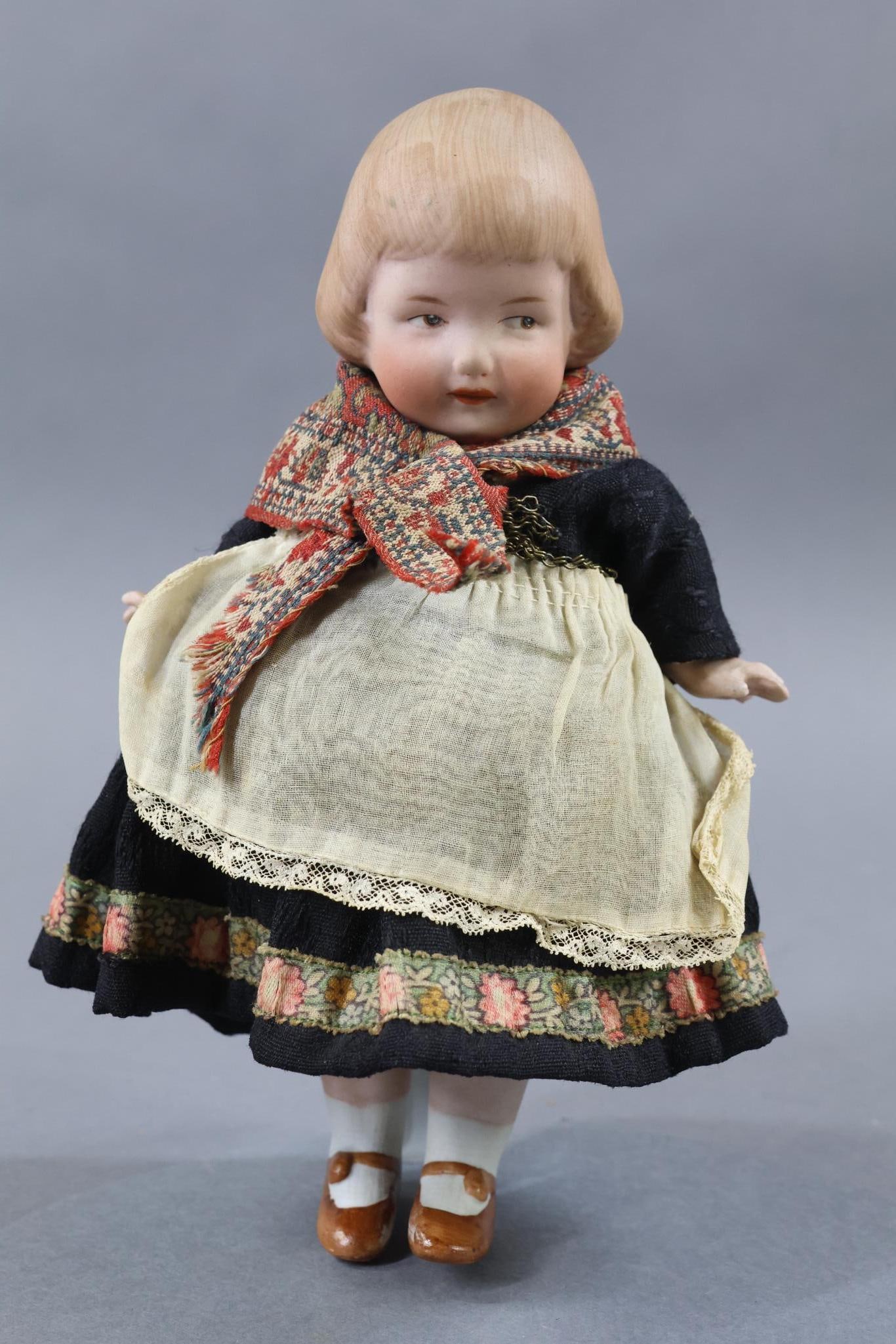 ALL BISQUE.: 8" Unmarked GEBRUDER HEUBACH Character Doll. Ca. 1925. Brown intaglio eyes, molded/painted brown bobbed hair, closed mouth. 5 Pc. body with painted brown shoes, white socks. All antique clothing. Stan