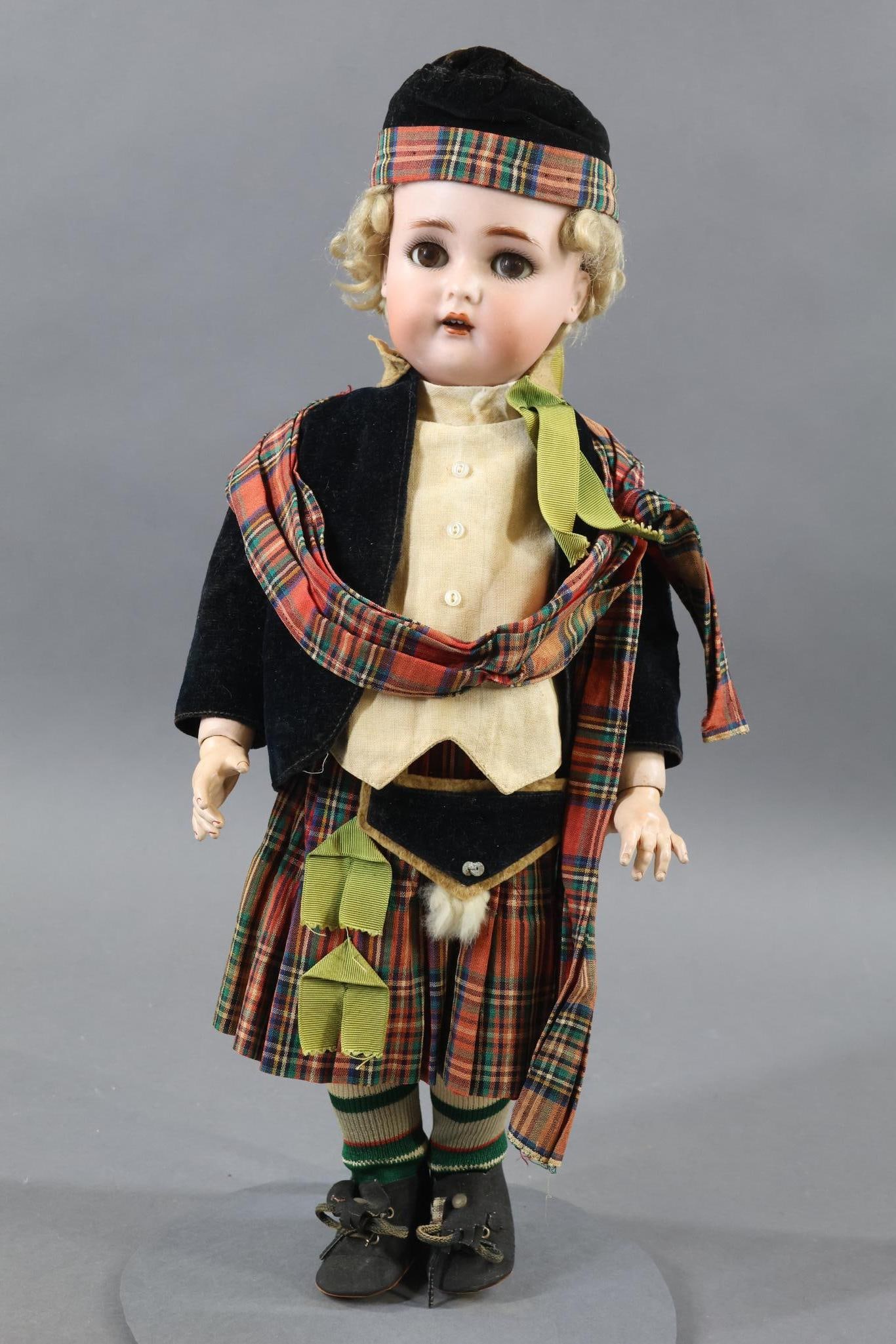 GERMAN BISQUE DOLLS.: 17 1/2" SIMON HALBIG K * R 46 Doll with brown sleep eyes, open mouth, pierced ears, curly blonde mohair wig. Papier mache ball jointed body. Dressed in antique Scottish outfit - velveteen jacket, line