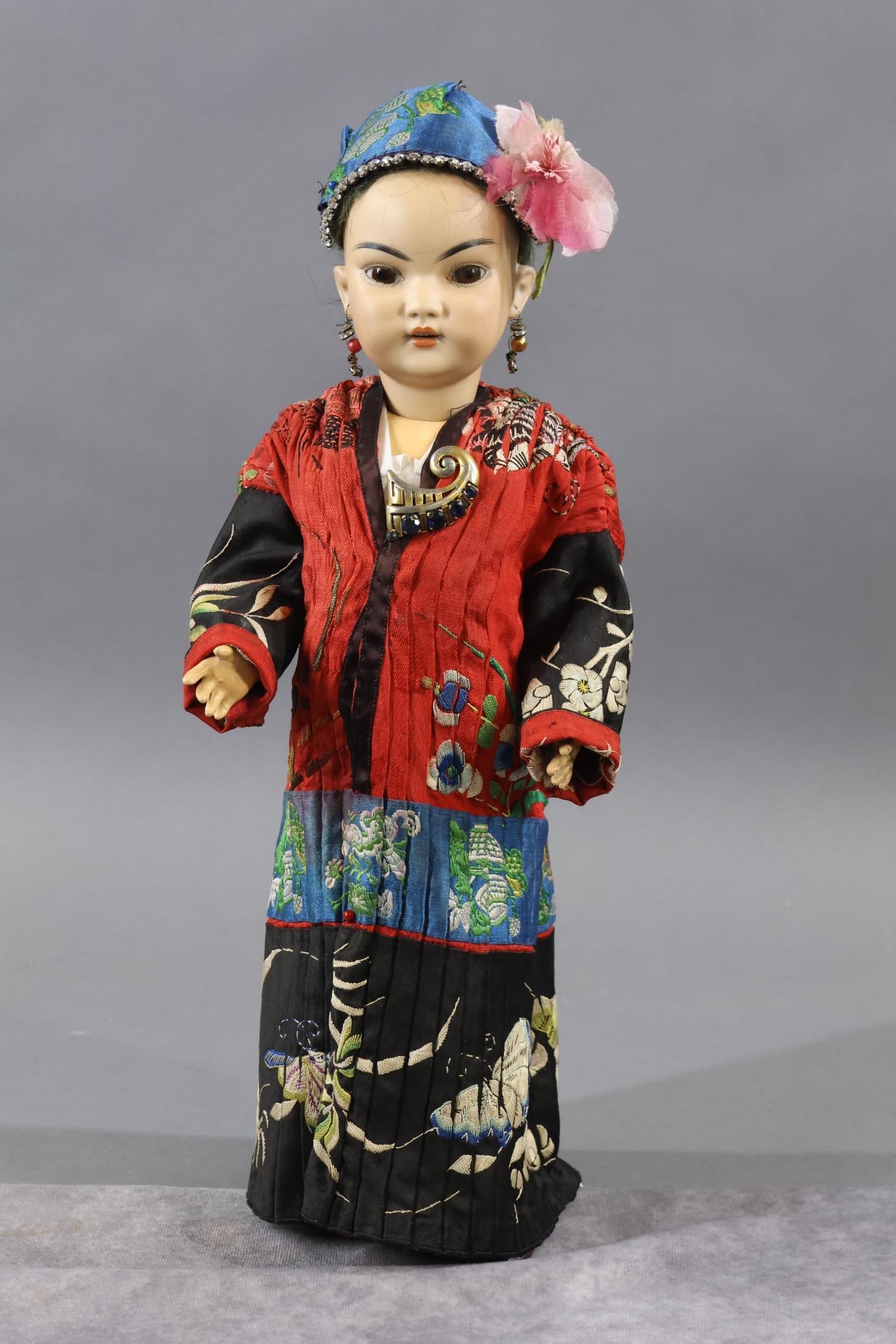 GERMAN BISQUE CHARACTER DOLLS.: 15 1/2" S & H 1199 DEP 6 Oriental Doll. Stationary brown eyes, pierced ears, black mohair wig. Papier mache ball jointed body. Dressed in antique silk clothing, hat. Leather shoes. Condition: flake on
