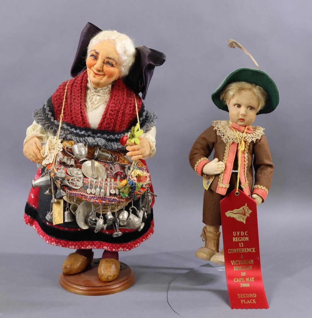 CLOTH DOLLS.: Pair of dolls. Doll 1) 11" Tagged LENCI "Castelrotto" boy doll. All original. Painted brown side glance eyes. Condition: age discoloration. Doll 2) 14" Tagged FRANCES D. RAVCA French Peddlar Lady doll