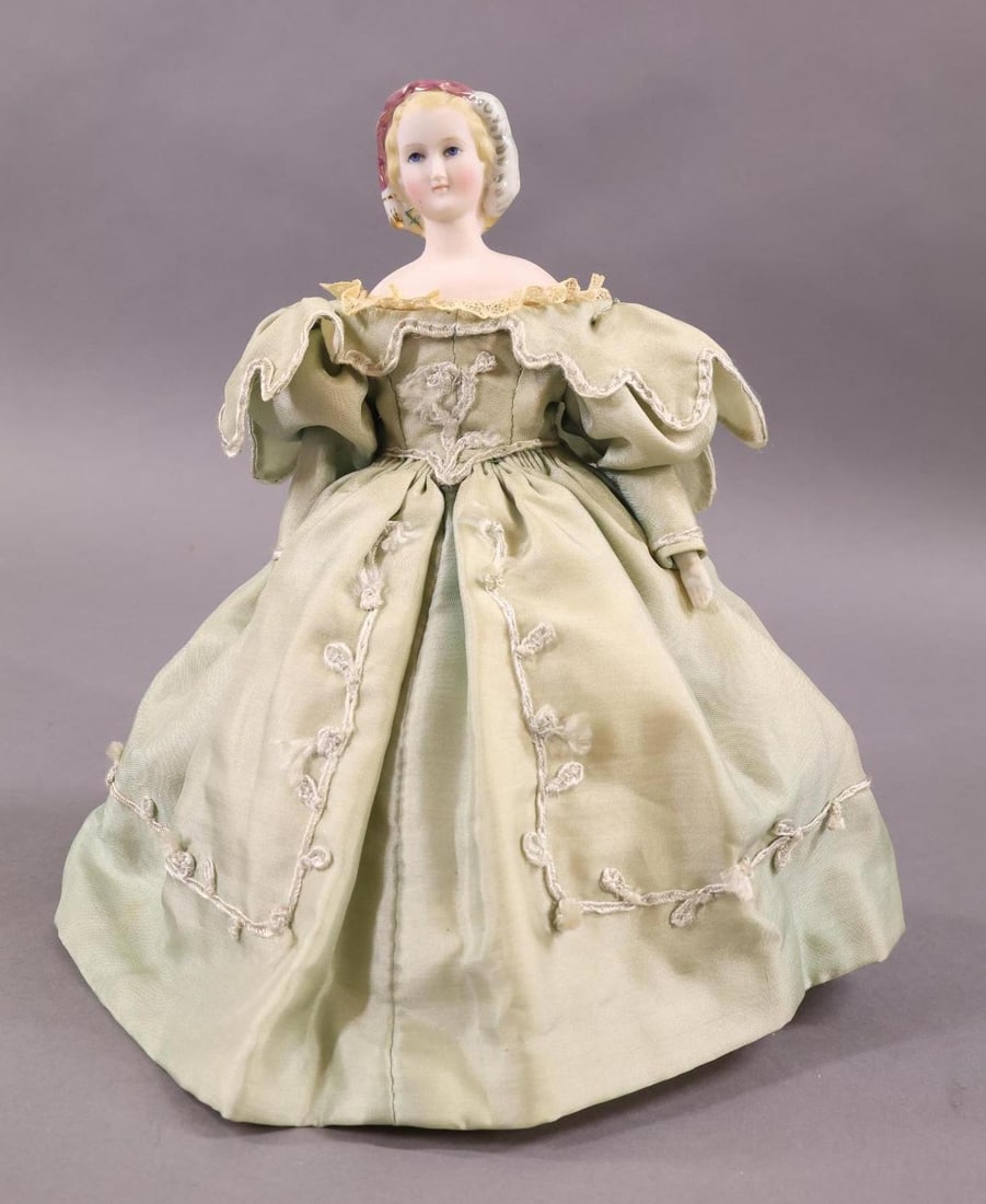 GERMAN BISQUE DOLLS 12" UNDER.: 9 1/2" Unmarked 1860's "Empress Eugenie" Doll with pale bisque shoulder head, glazed feather and hair decoration. Made by Alt, Beck and Gottschalck. Delicately painted features. Cloth body, parian low