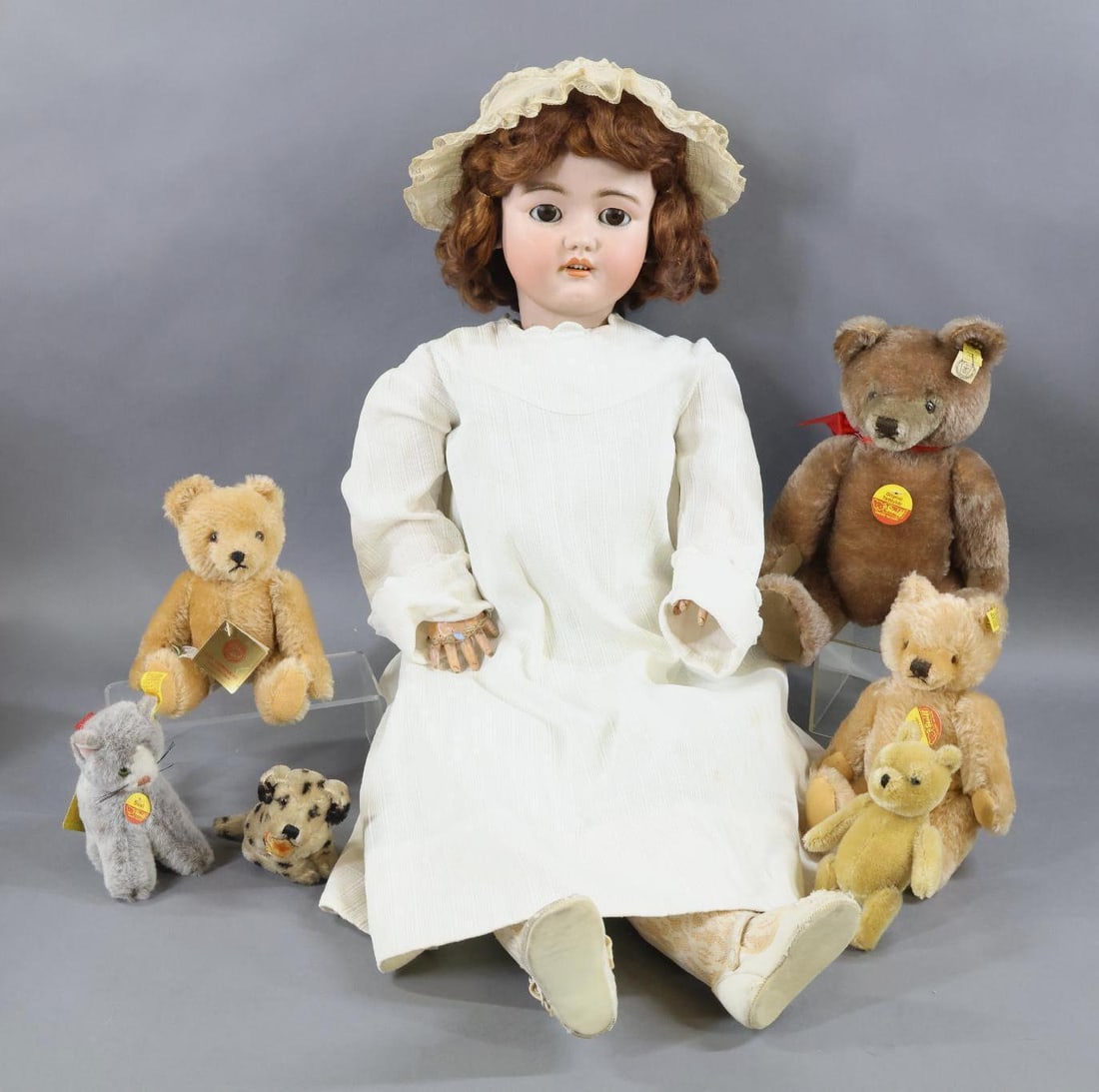 GERMAN BISQUE DOLLS & STEIFF/OTHER.: LOT. Doll - 34" GERMANY HALBIG S & H 15 1/2 Doll with stationary brown eyes, pierced ears, open mouth, henna mohair wig. Papier mache ball jointed body. Dressed in antique/vintage cotton children's cl