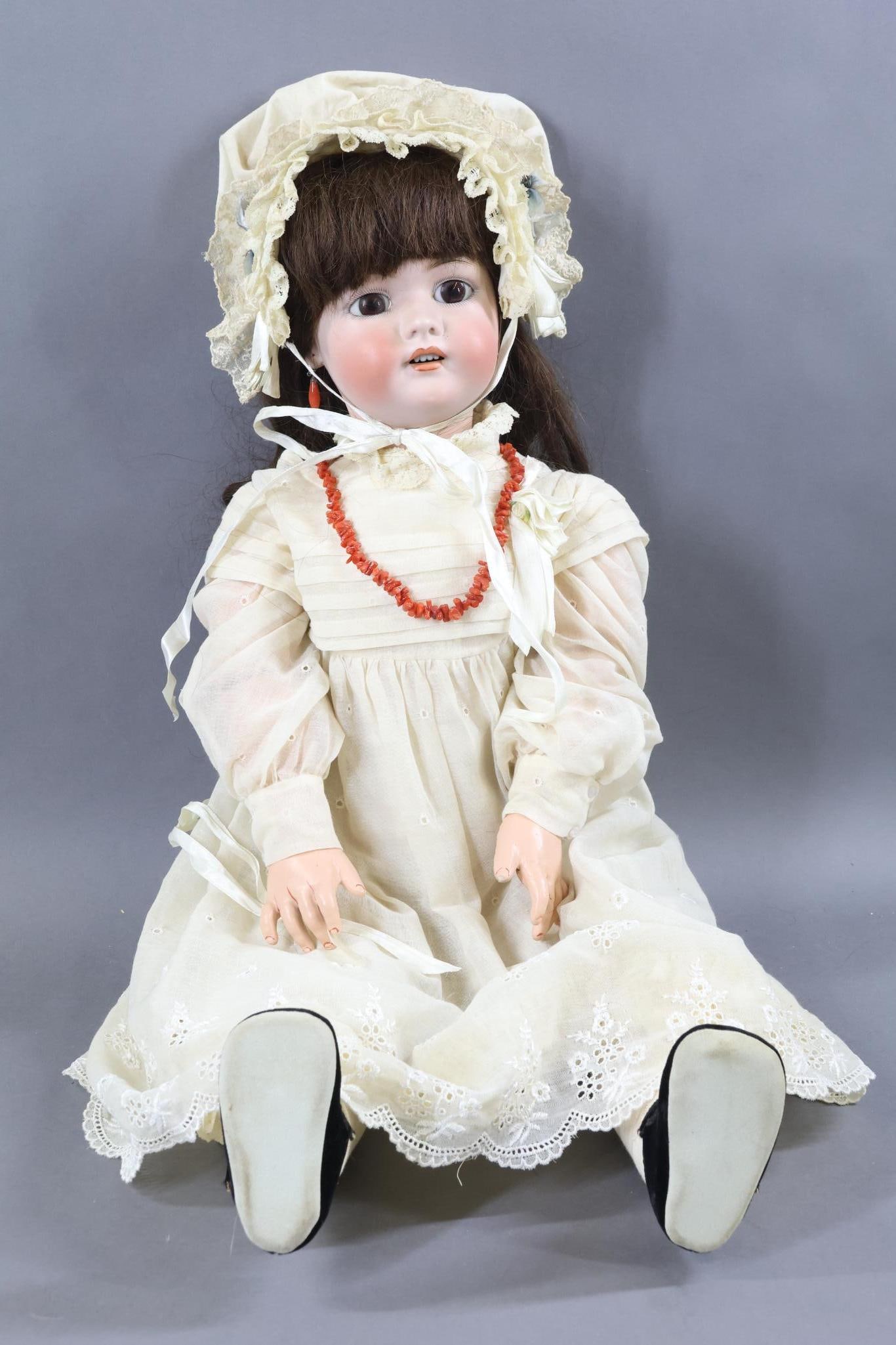 GERMAN BISQUE DOLLS.: 30" "Dolly Grace" 1078 SIMON & HALBIG 14 Doll with stationary brown eyes, open mouth, pierced ears, long curly brown HH wig. Papier mache ball jointed body. Dressed in vintage cotton clothing. Eyelet 