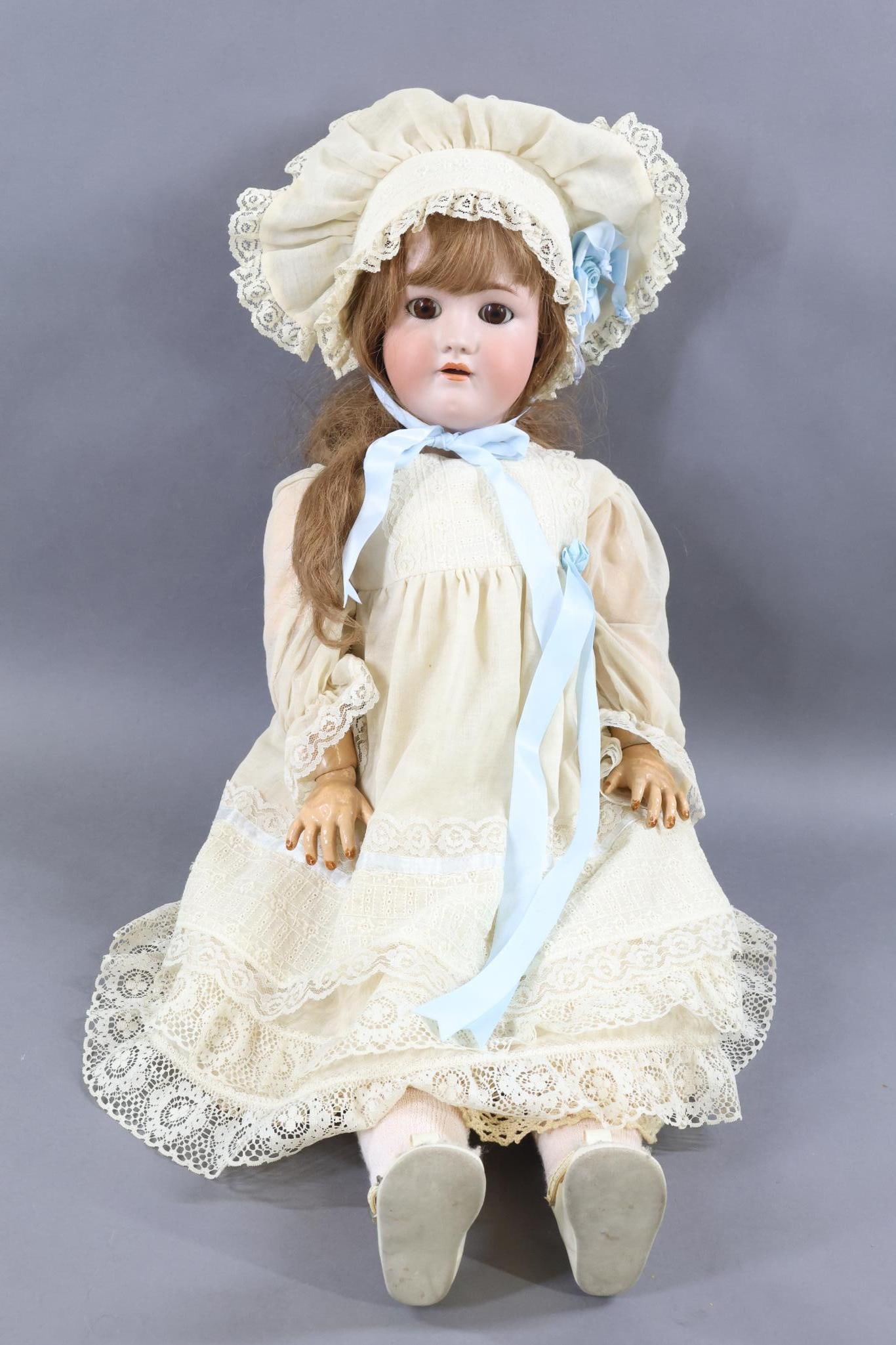 GERMAN BISQUE DOLLS.: 32" GERMANY SIMON & HALBIG HEINRICH HANDWERCK 6 1/2 Doll with stationary brown eyes, open mouth, pierced ears, long brown French HH wig. Papier mache ball jointed body. Dressed in antique and vintage 