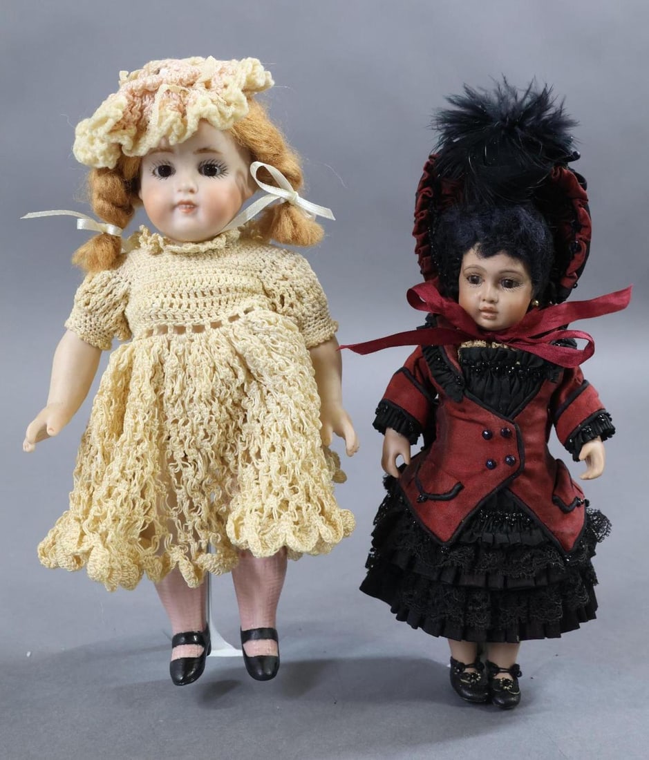 ARTIST DOLLS - FRENCH & GERMAN.: Pair of dolls. French - 7" 1998 Black BRU by artist Cathy Hansen. Stationary eyes, closed mouth, mohair wig. Bisque socket head on a bisque shoulder plate, leather body, bisque lower arms and legs. Be
