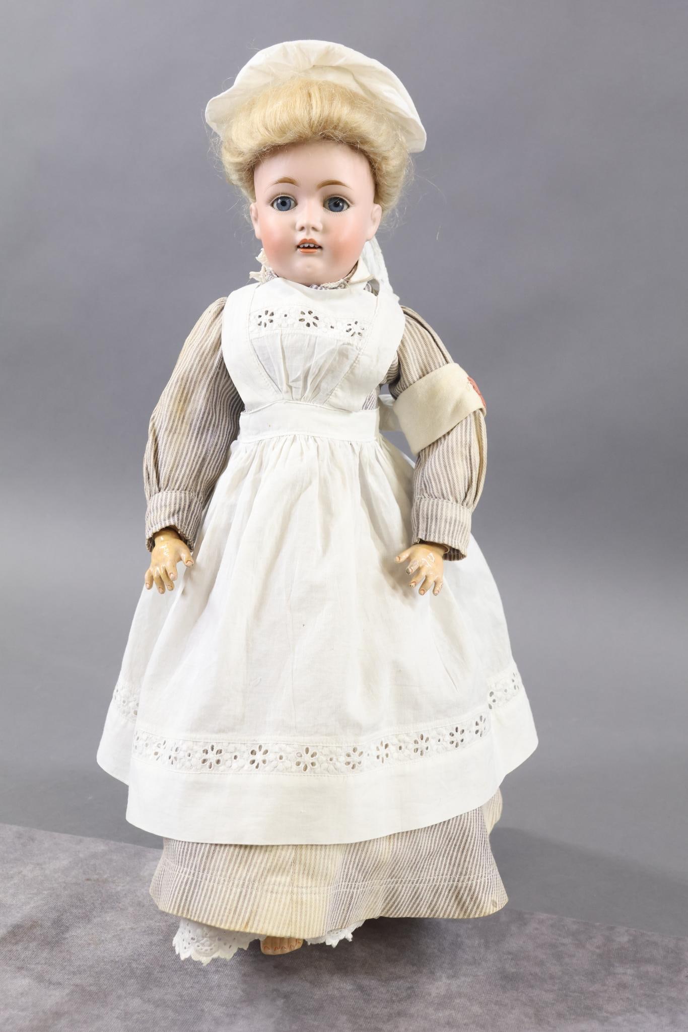 GERMAN BISQUE LADY DOLL.: 17" KESTNER Lady Doll. 0 MADE IN GERMANY 8. 162 Doll with blue sleep eyes, open mouth, blonde mohair wig. Papier mache fully jointed LADY body. Dressed in antique cotton clothing - striped nurses unif
