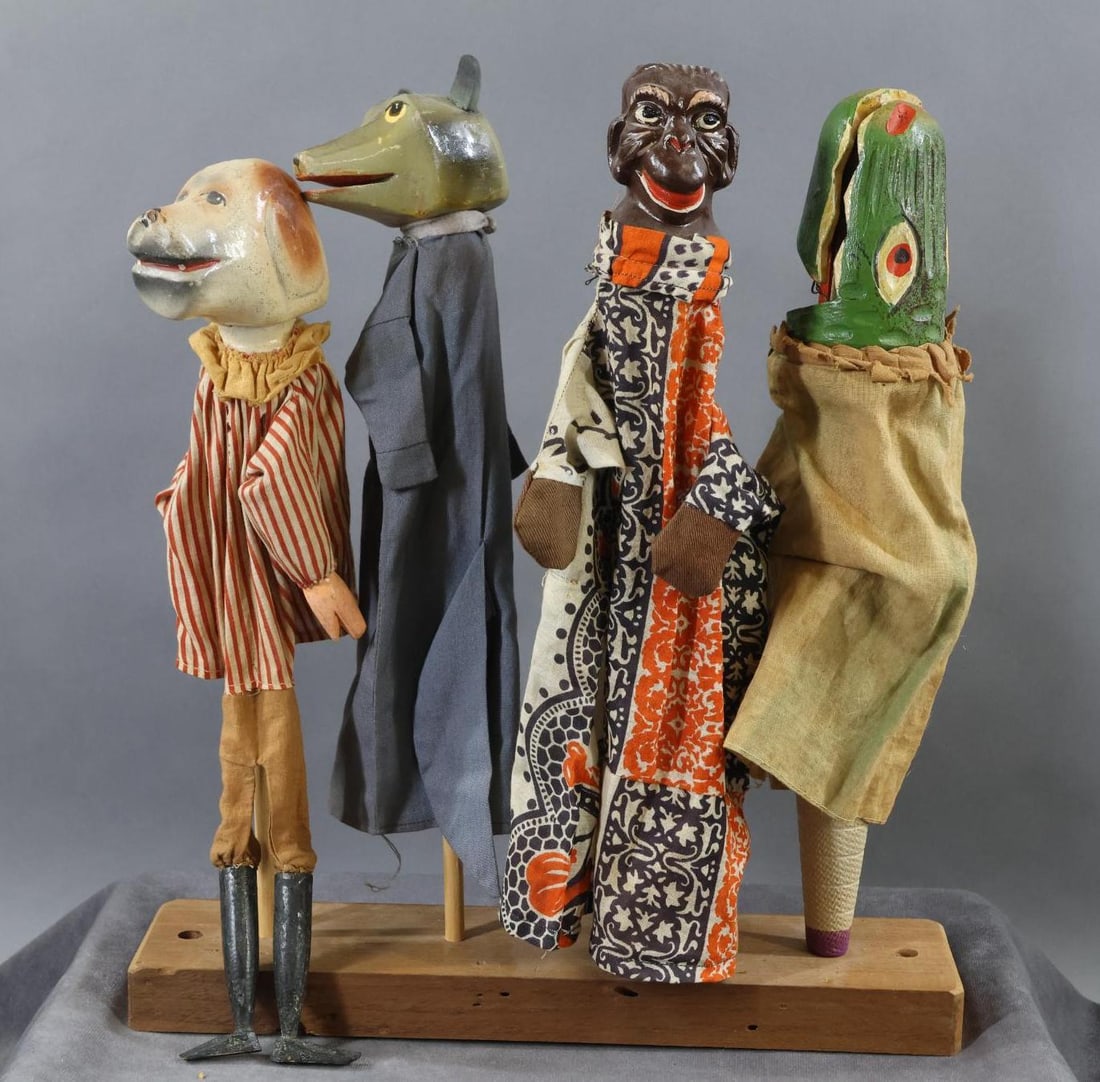 NOVELTY DOLLS/TOYS.: LOT of antique "Punch & Judy" type puppets. (4) Animal/reptile puppets with carved wooden heads. (1) Has wooden hands, lower legs. Dog. Wolf. Monkey. Crocodile. Dog is 14". They are mounted on a woode