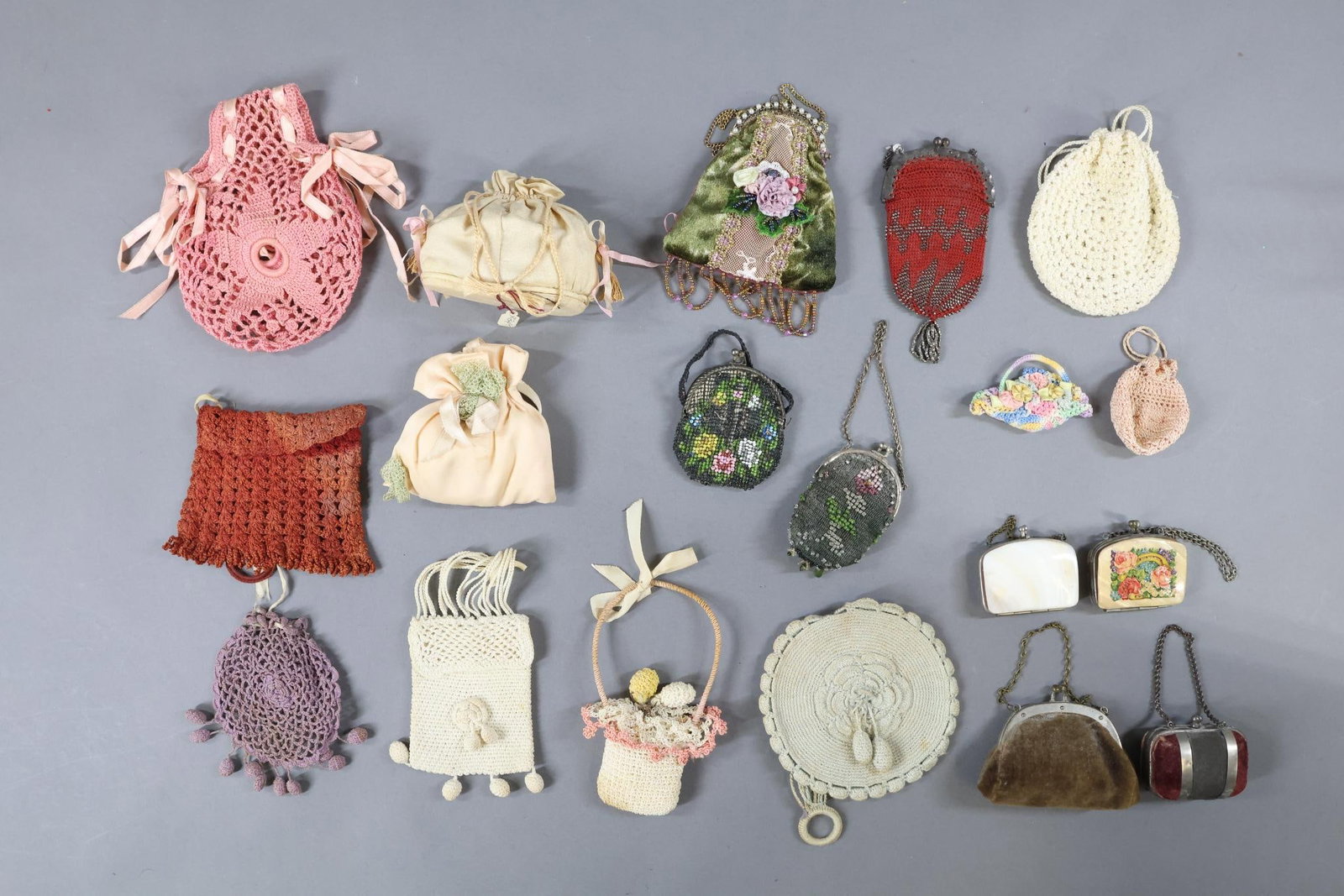 ACCESSORIES, SUPPLIES.: LOT of (19) antique and vintage Doll Purses. Shell, beaded, crocheted, velvet, silk. 1 1/2" - 5". Condition: age discoloration, loss. This lot is being sold AS IS.