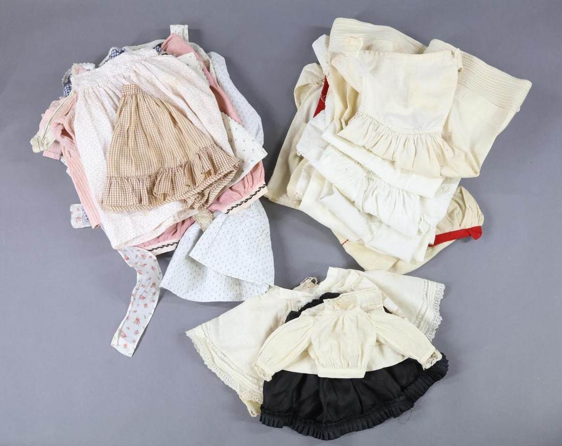ACCESSORIES, CLOTHING: LOT of antique doll/children's clothing. Clothing made with printed or colored cotton - child's dress, pinafores. Doll - dresses, apron, blouses/tops, embroidered romper, skirt/petticoat. White cotton