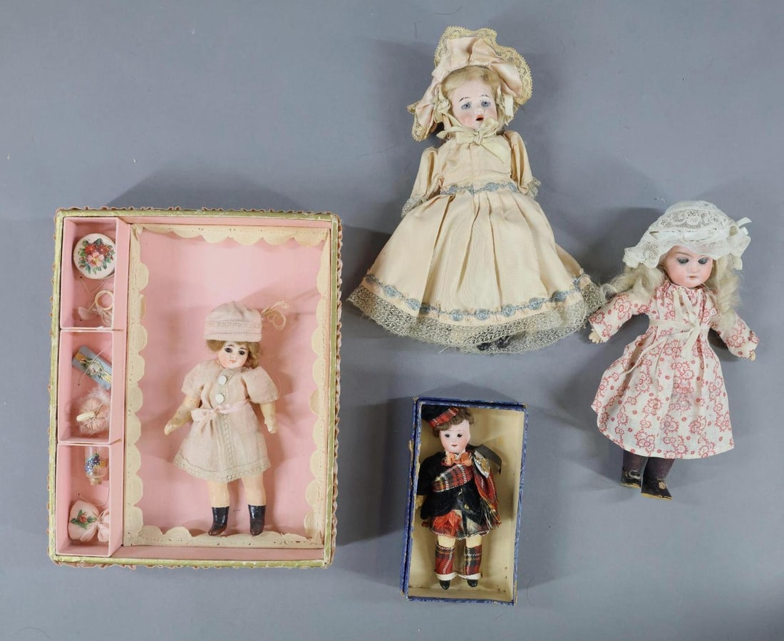GERMAN BISQUE DOLLS - 12" UNDER.: LOT of (4) Dolls. The first (3) have stationary eyes. They all have mohair wigs, papier mache bodies and are dressed in vintage/antique clothing. Doll 1) 5" "Stewart Clan" doll tied into OB. 5 Pc. bod