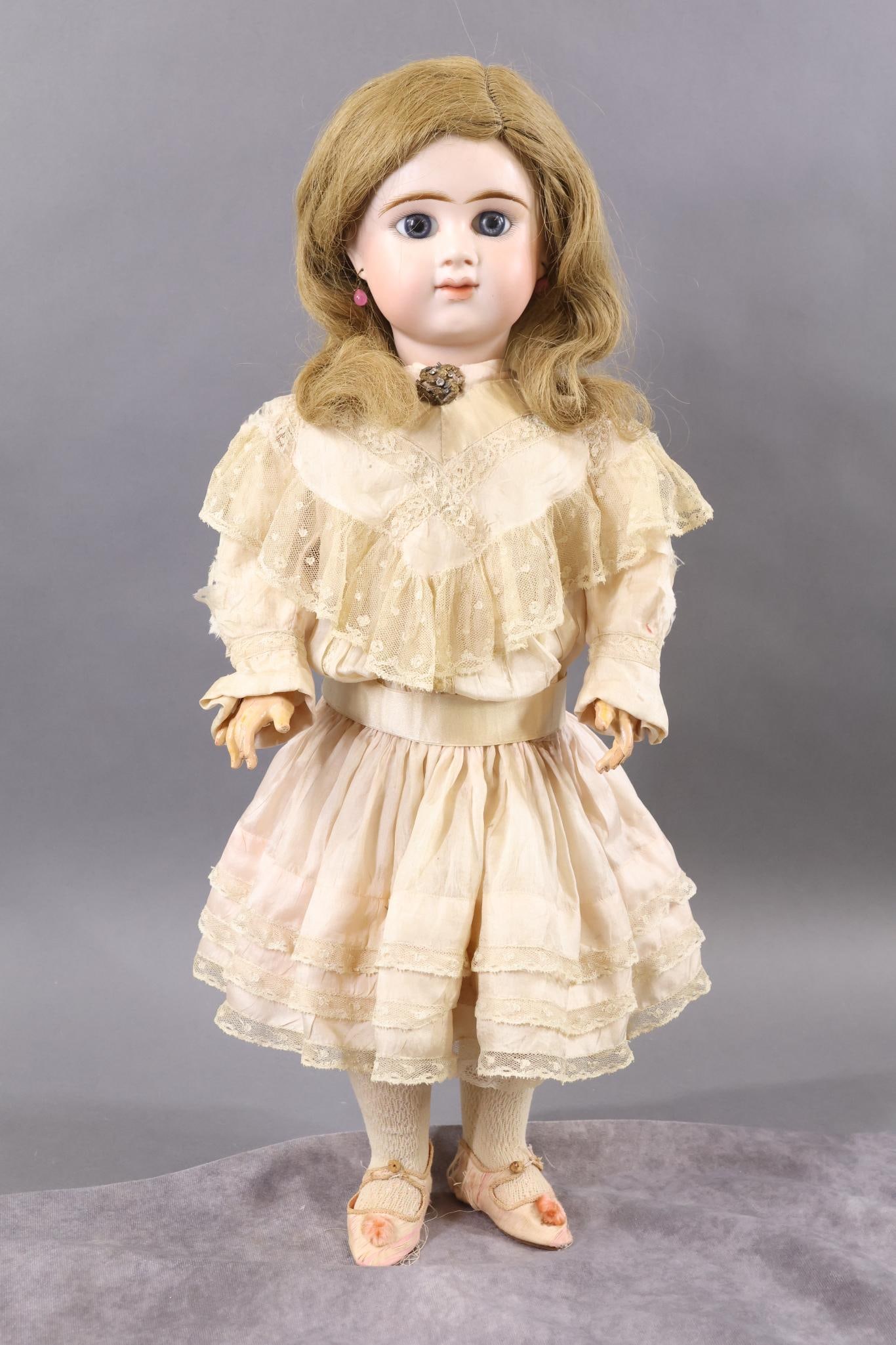 FRENCH BISQUE DOLLS.: 22" (Incised) E 10 D DEPOSE Doll. (E.D. BEBE). Blue paperweight eyes, closed mouth, pierced ears, honey blonde HH wig. Unmarked papier mache/wood fully jointed body with separate hands. Dressed in ant