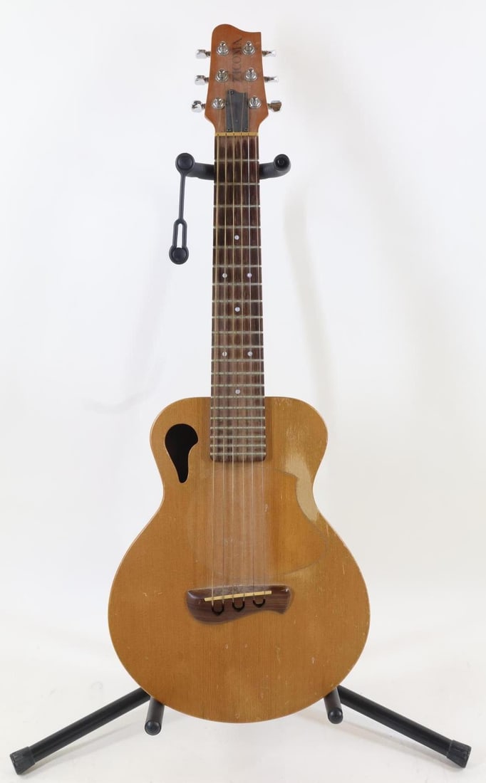 Tacoma Papoose Guitar: Tacoma P-1 Papoose Treble Guitar. Serial Number D2155110. Made in USA, 2000. Good Playing Condition. No Open Cracks. Structurally Sound. Heavy Fret and Finish Wear. Multiple Nicks, Dents and Scratches