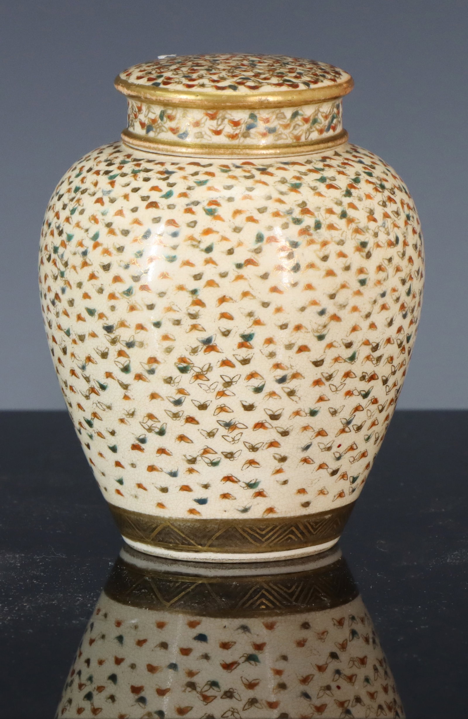 Japanese Satsuma Pottery Jar: Meiji - Taisho era covered jar with the thousand butterflies motif. Appears to be marked Asari. 4"h x 2.75"w