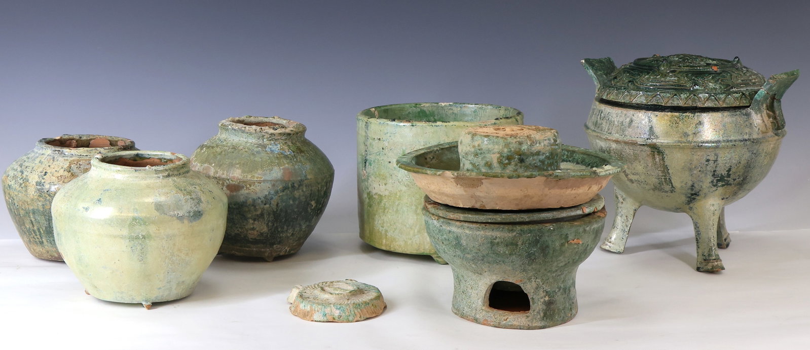 Chinese Han Green Glazed Pottery Fountain: Han Dynasty green glazed terracotta pottery vessels and other parts which together form a fountain, with varying degrees of iridescence. Includes a double handled censer with tripod paw feet, the cove
