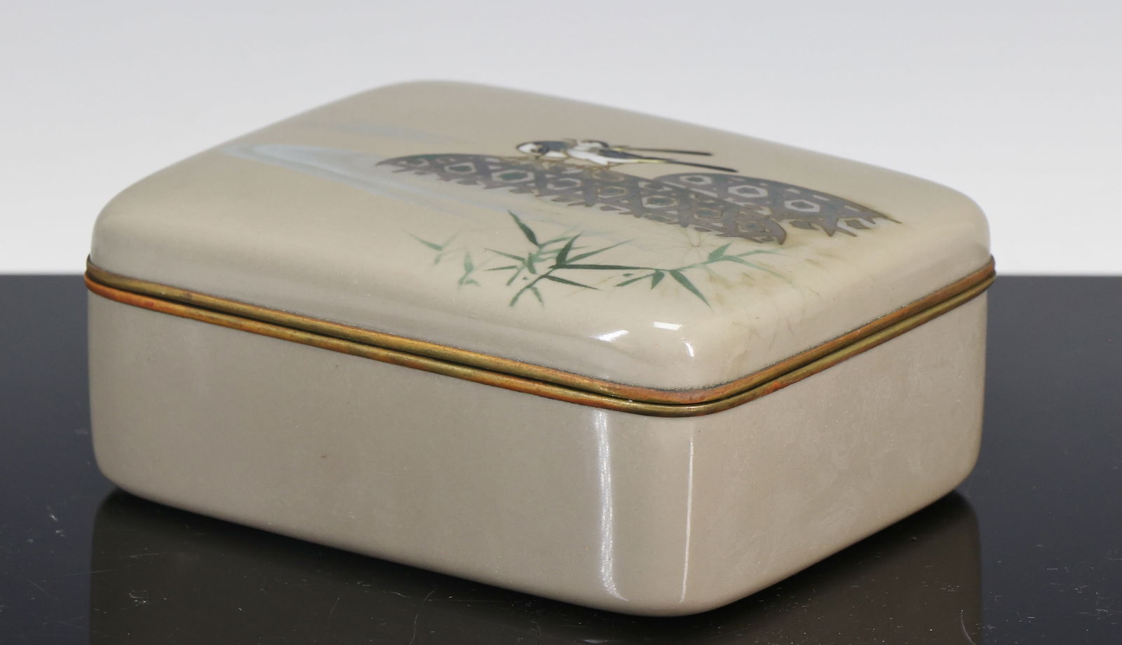 Japanese Cloisonne Box: Meiji - Taisho era silver wire cloisonne box, the top decorated with birds perched on fish traps with bamboo in the foreground, on a gray ground, with silver plate mounts, and a silk lined interior. U