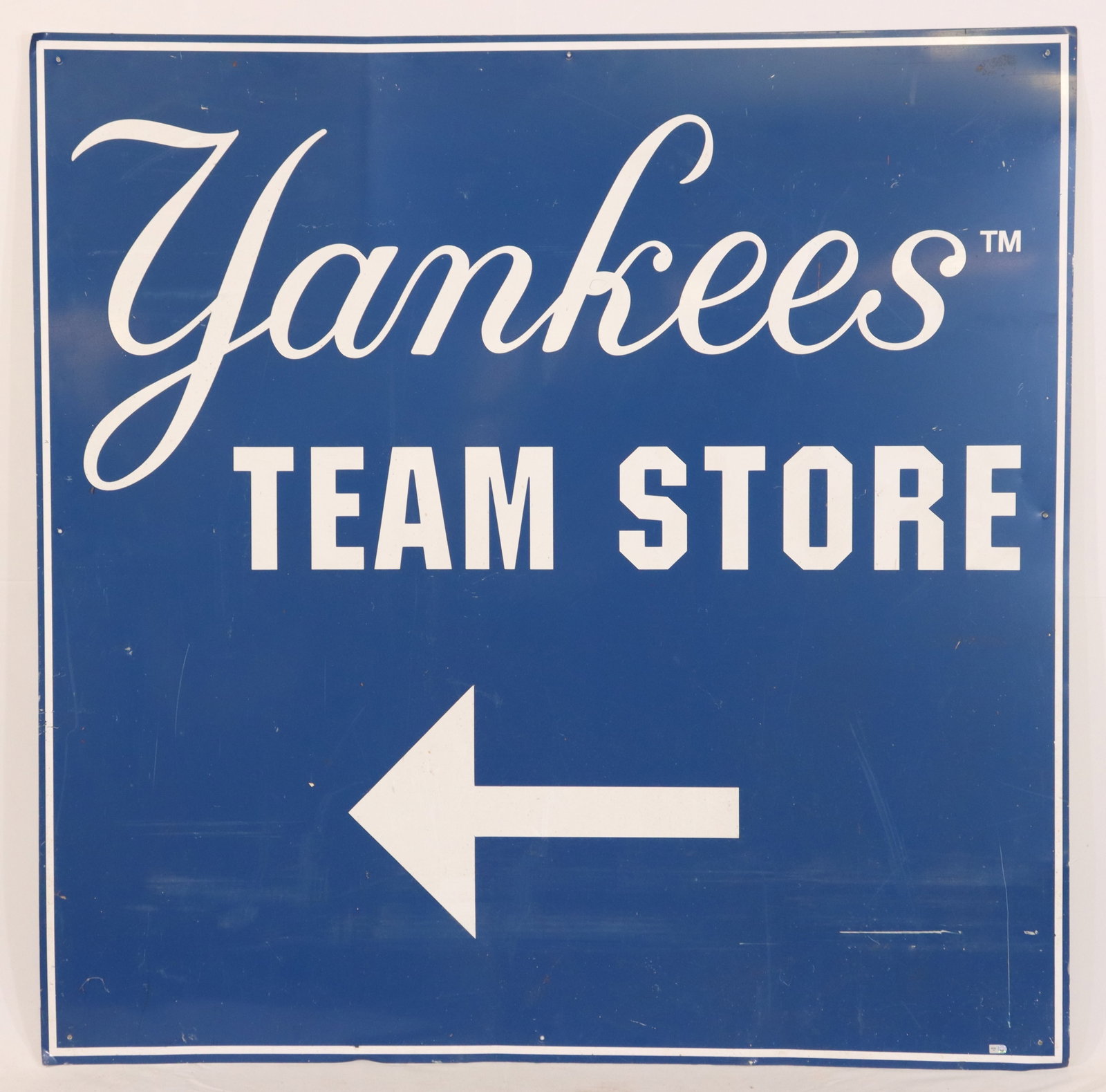 Aluminum "Yankees Team Store" Sign: This 4' x 4' aluminum sign serves as a directional marker for a 'Yankees Team Store.' Recognizable by its iconic blue and white design featuring the Yankees logo font and bold lettering, this sign inc